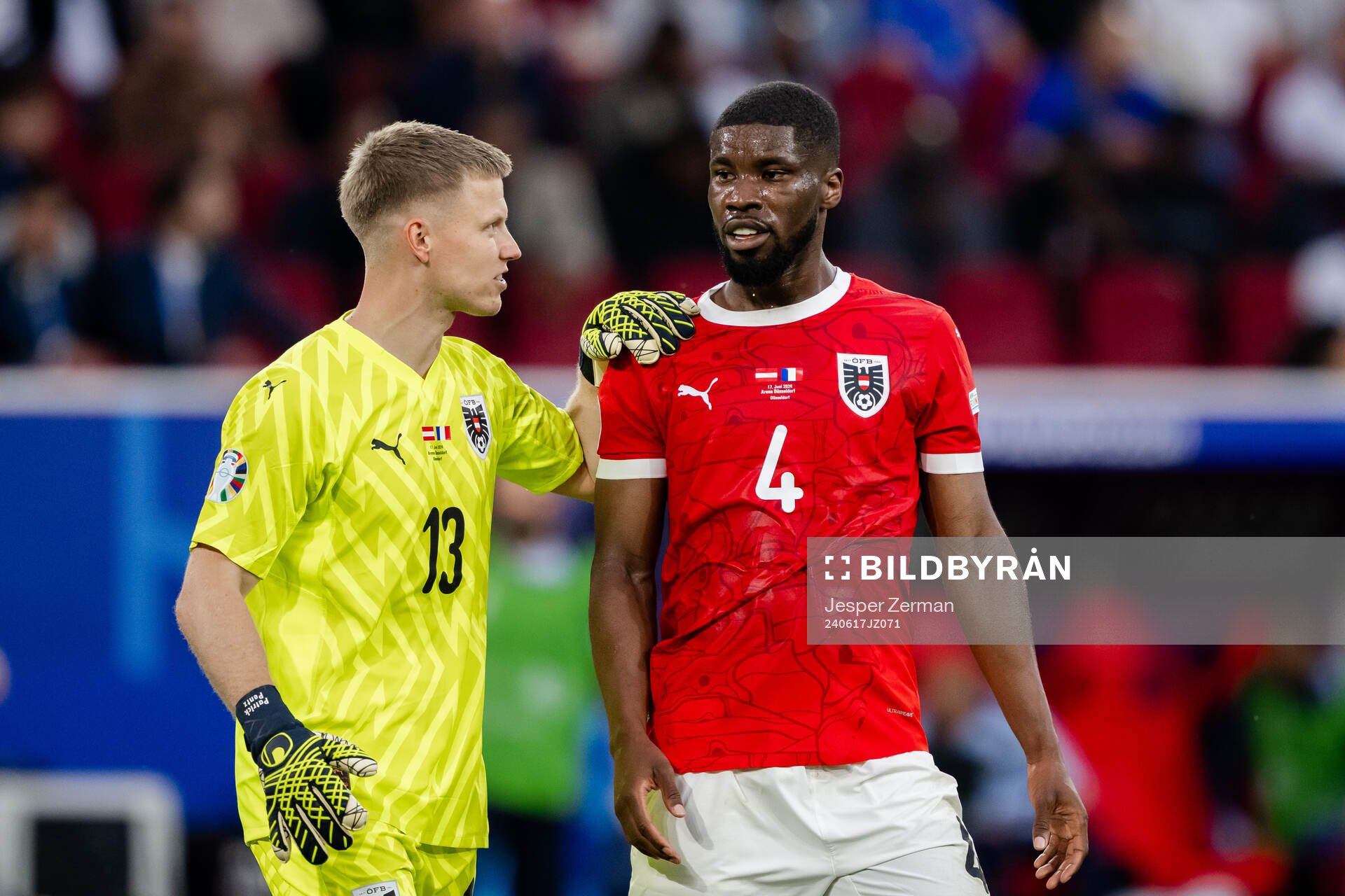 Goalkeeper Patrick Pentz and Kevin Danso of Austria