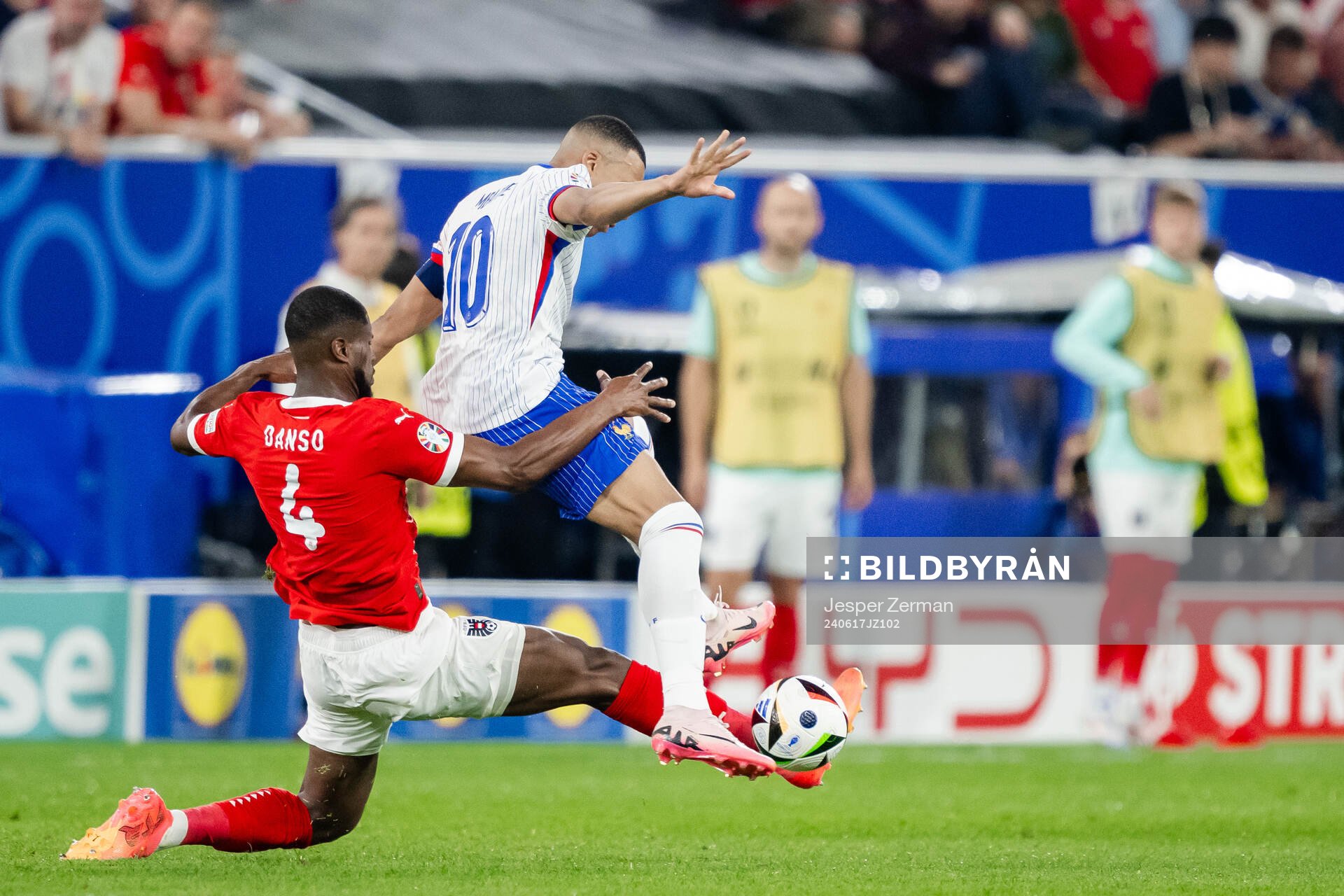 Kevin Danso of Austria and Kylian Mbappé of France