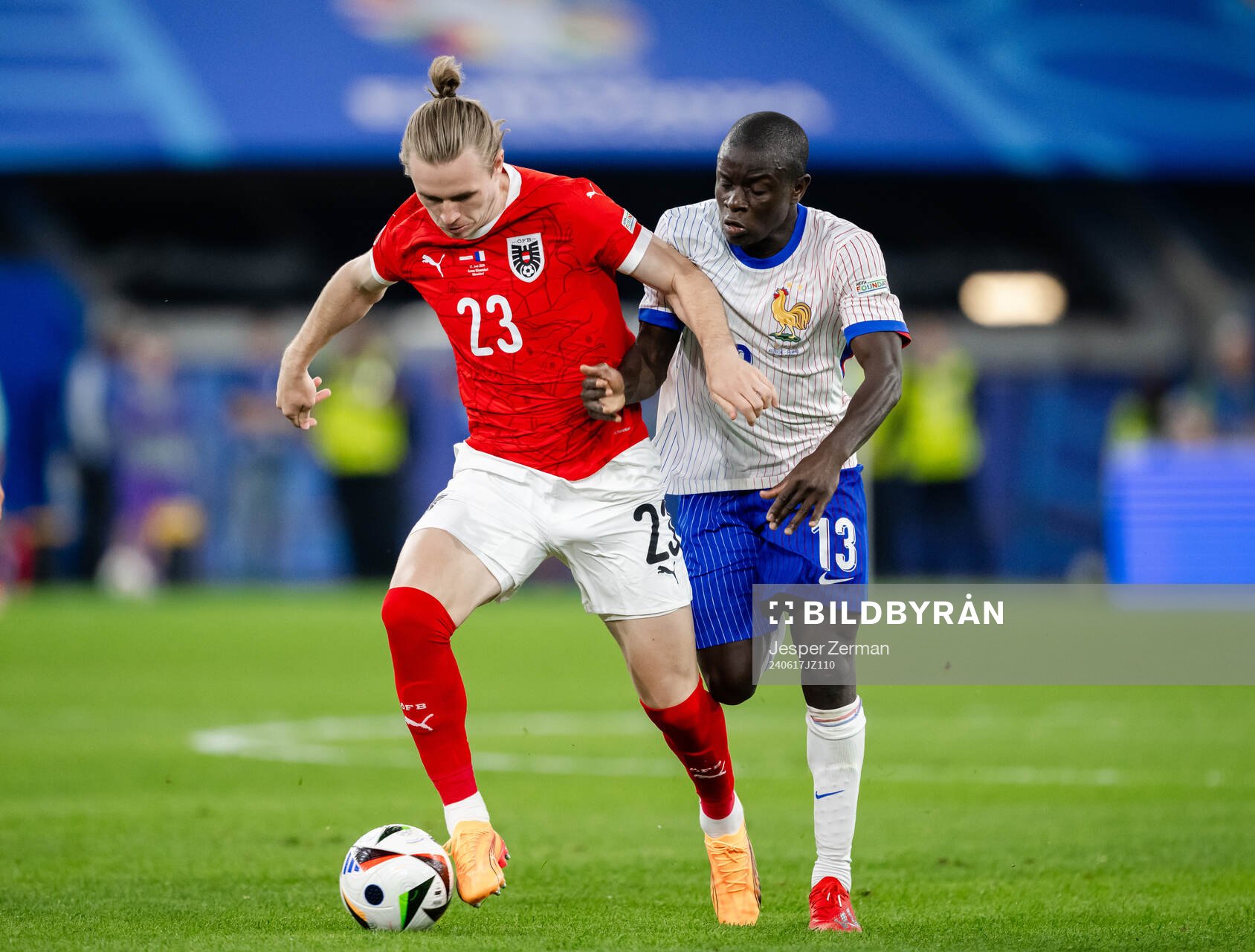 Patrick Wimmer of Austria and N'Golo Kanté of France