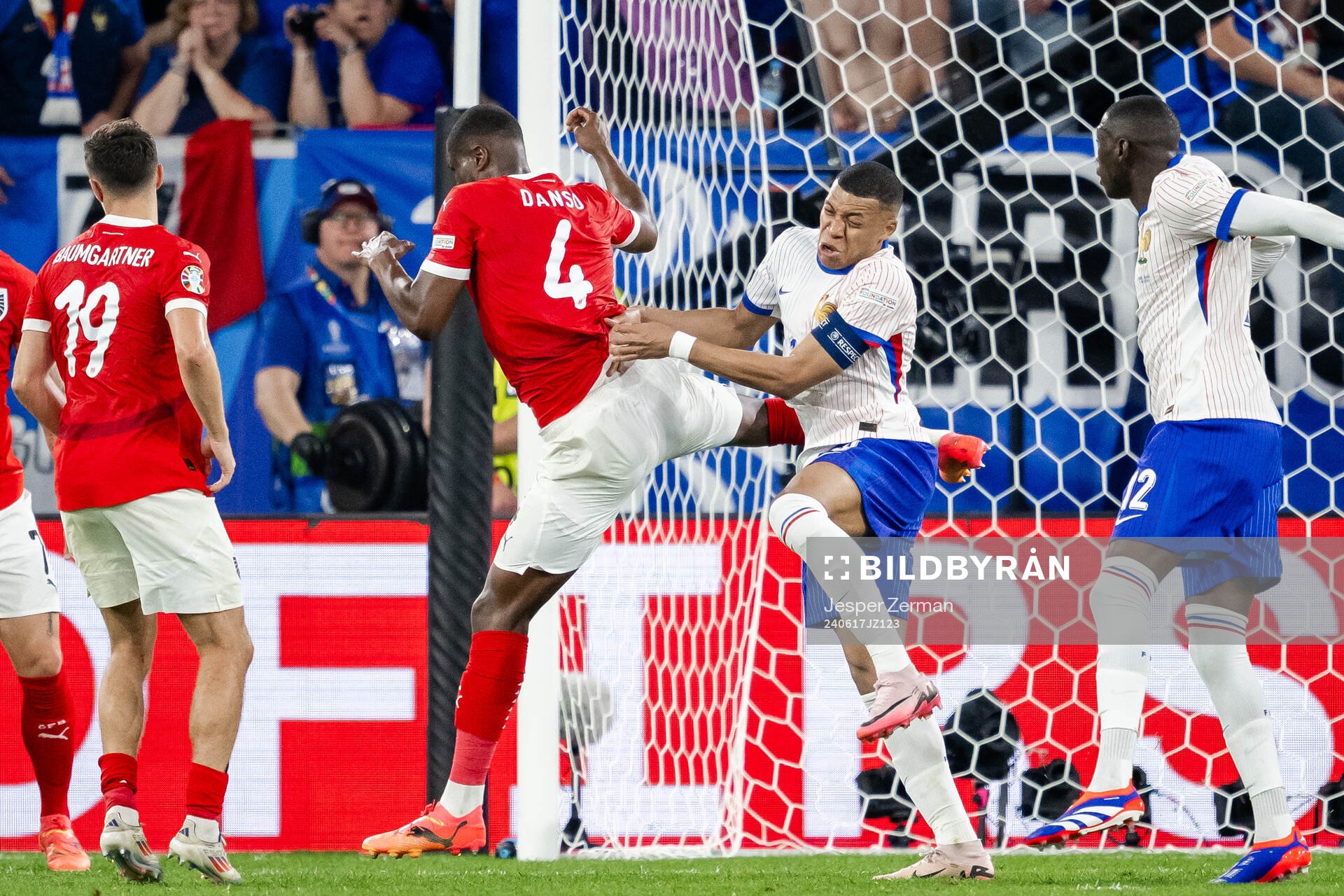 Kevin Danso of Austria and Kylian Mbappé of France