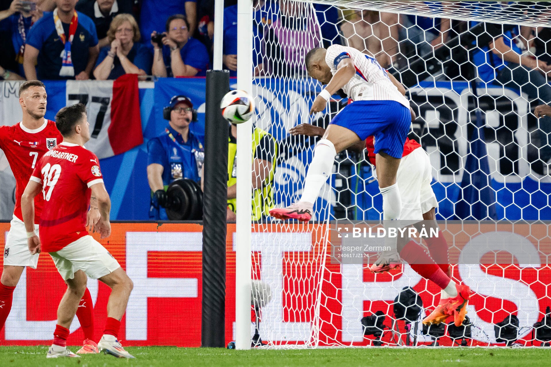 Kevin Danso of Austria and Kylian Mbappé of France