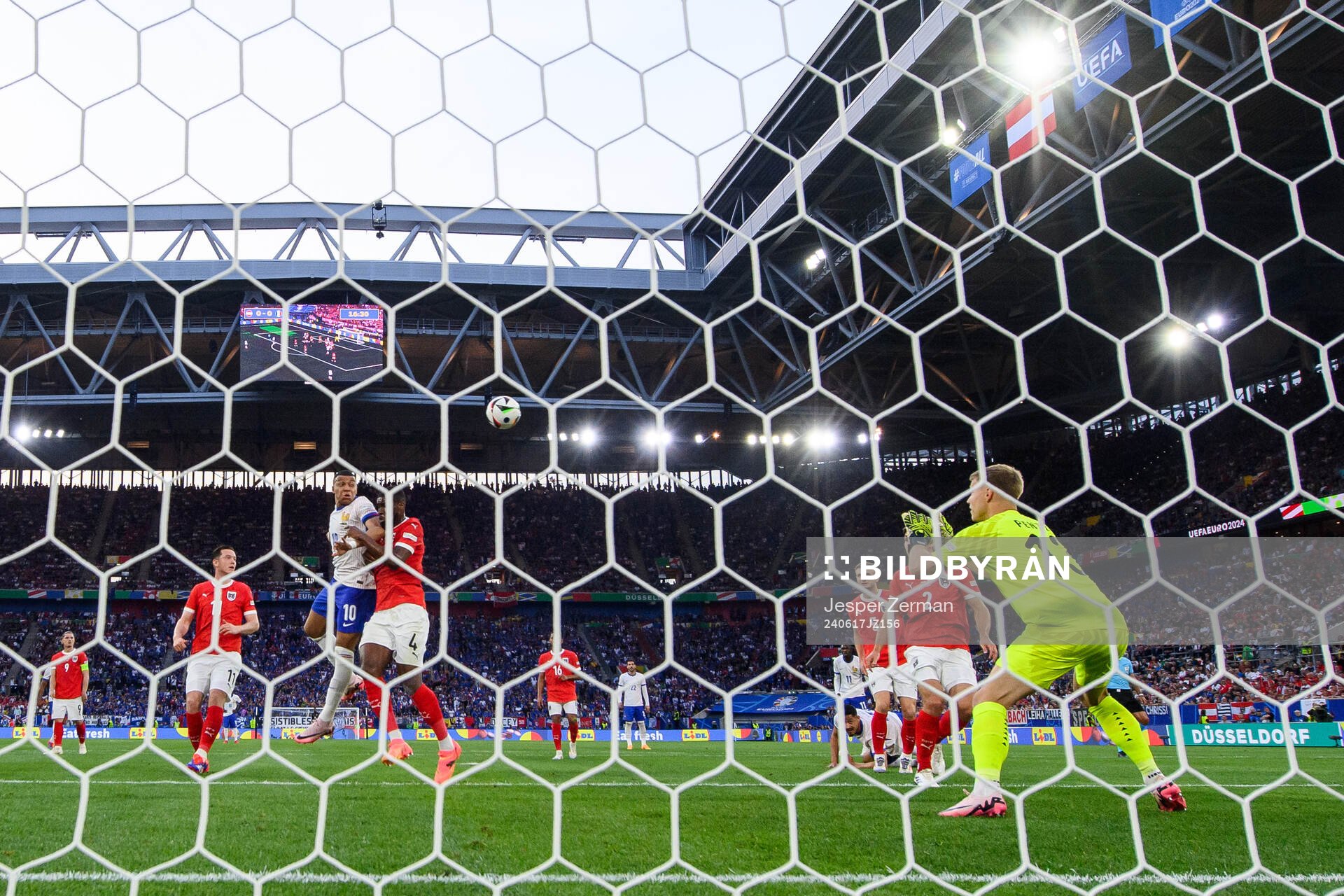 Kylian Mbappé of France against Kevin Danso and goalkeeper