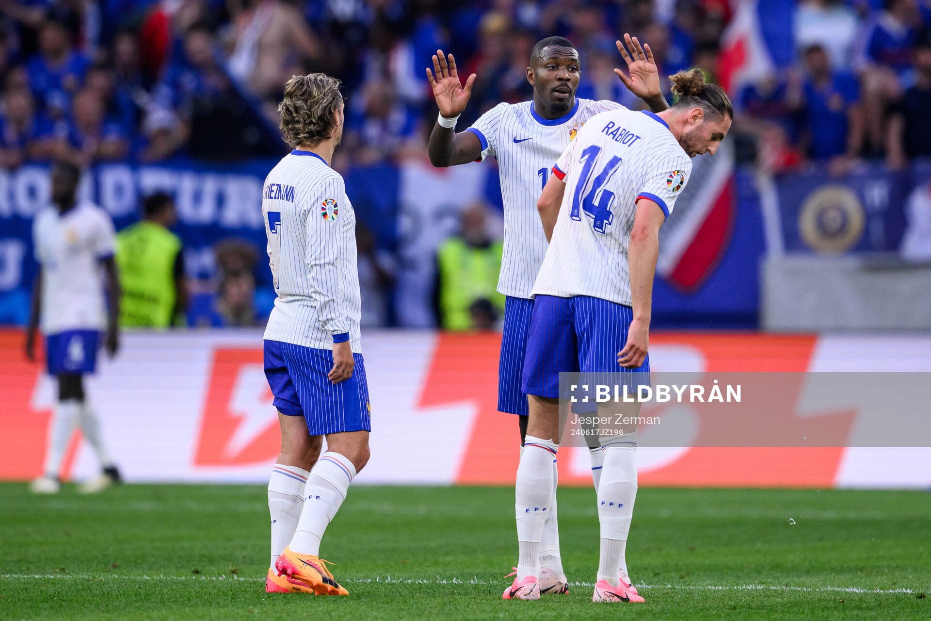 Antoine Griezmann, Marcus Thuram and Adrien Rabiot of France