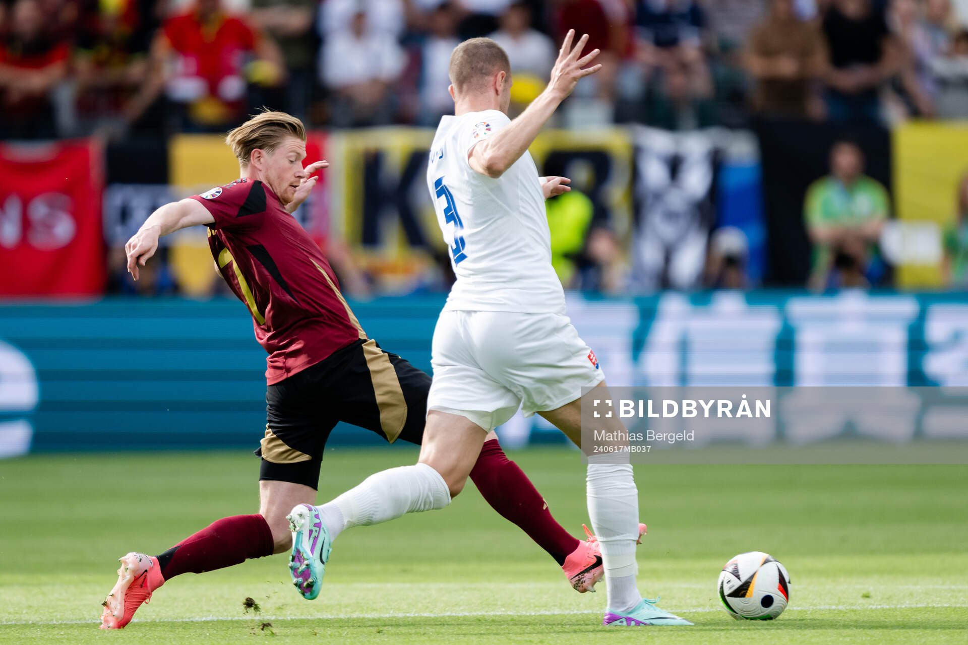 Kevin De Bruyne of Belgium and Denis Vavro of Slovakia