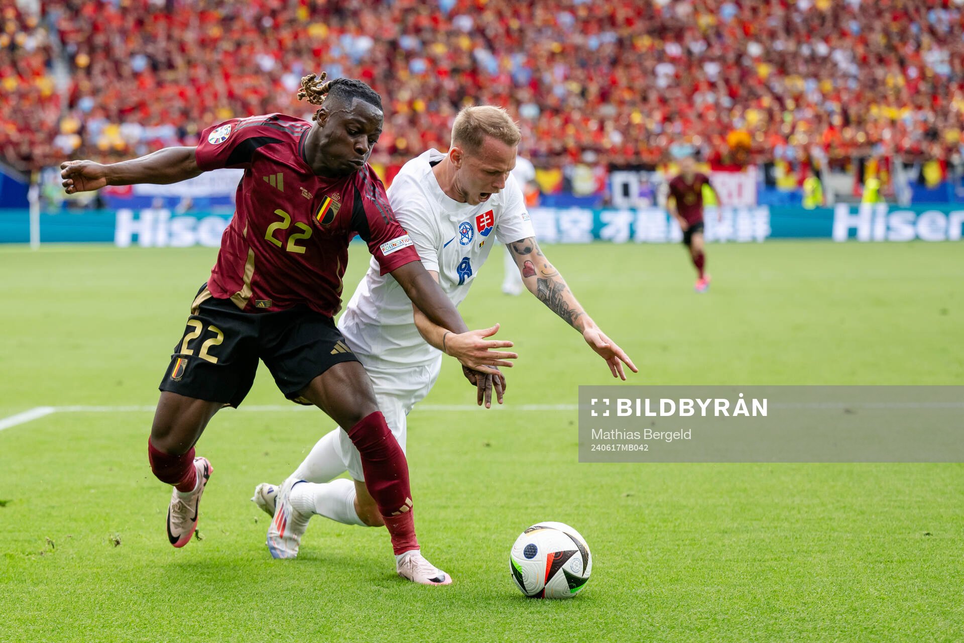 Jeremy Doku of Belgium and Ondrej Duda of Slovakia