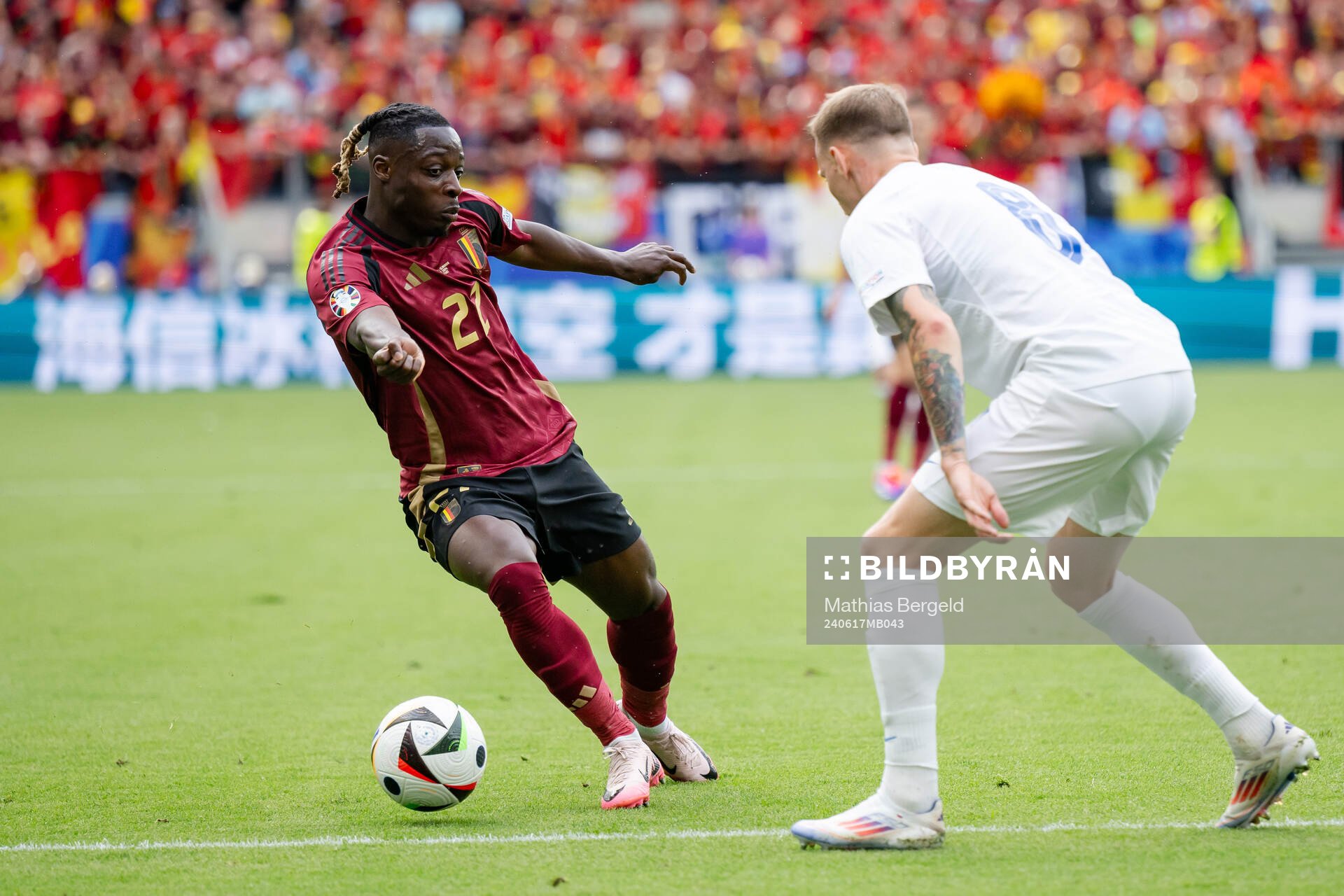 Jeremy Doku of Belgium and Ondrej Duda of Slovakia