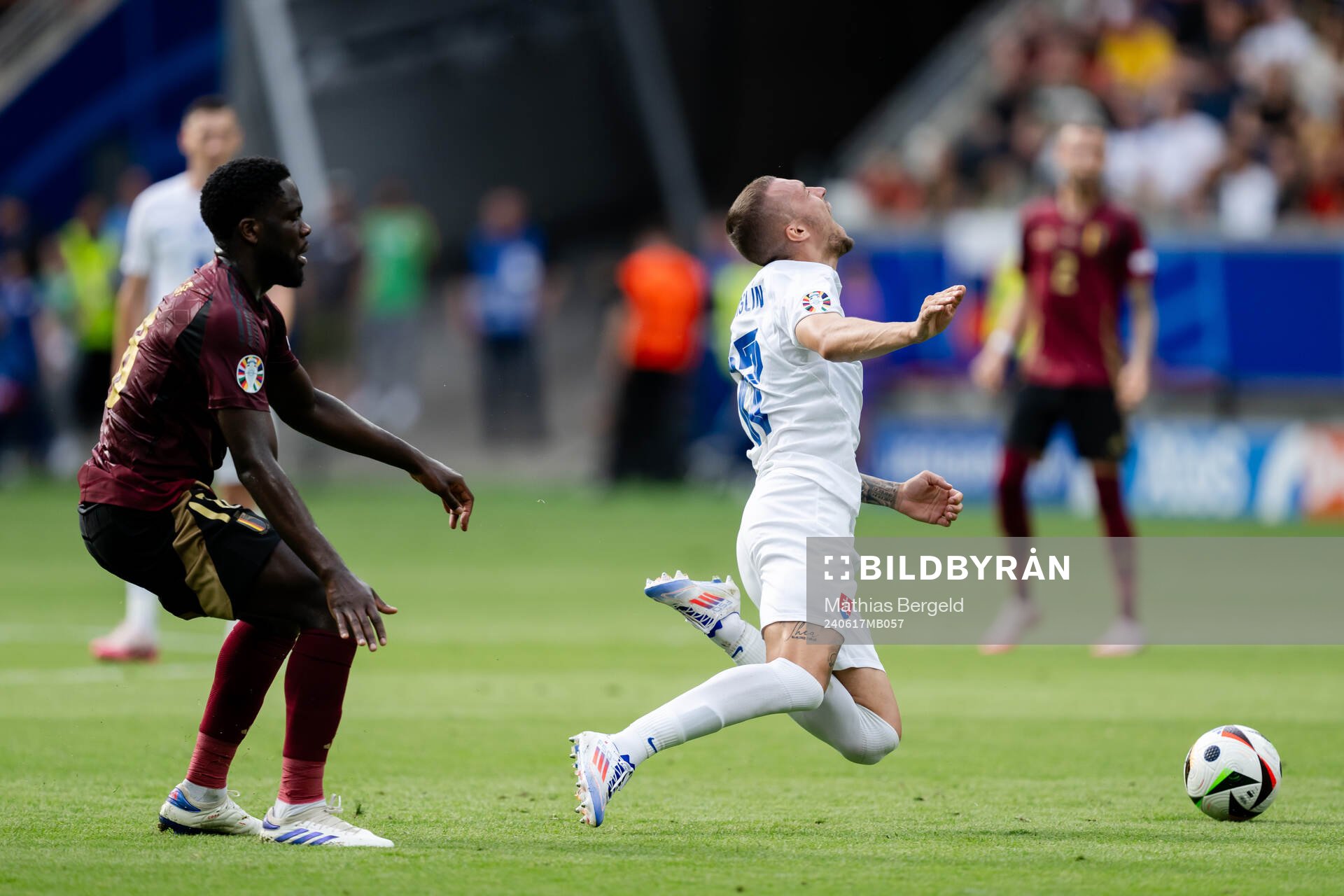Orel Mangala of Belgium and Lukas Haraslin of Slovakia