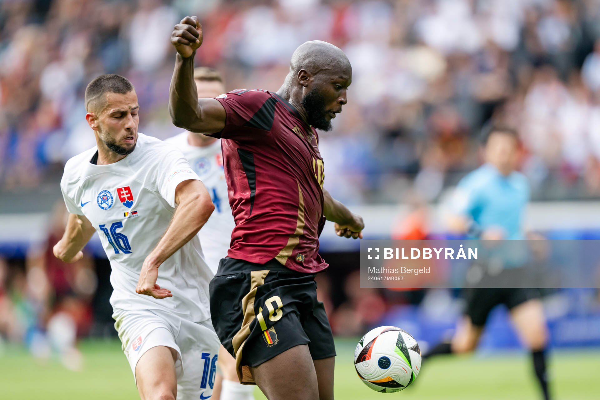 David Hancko of Slovakia and Romelu Lukaku of Belgium