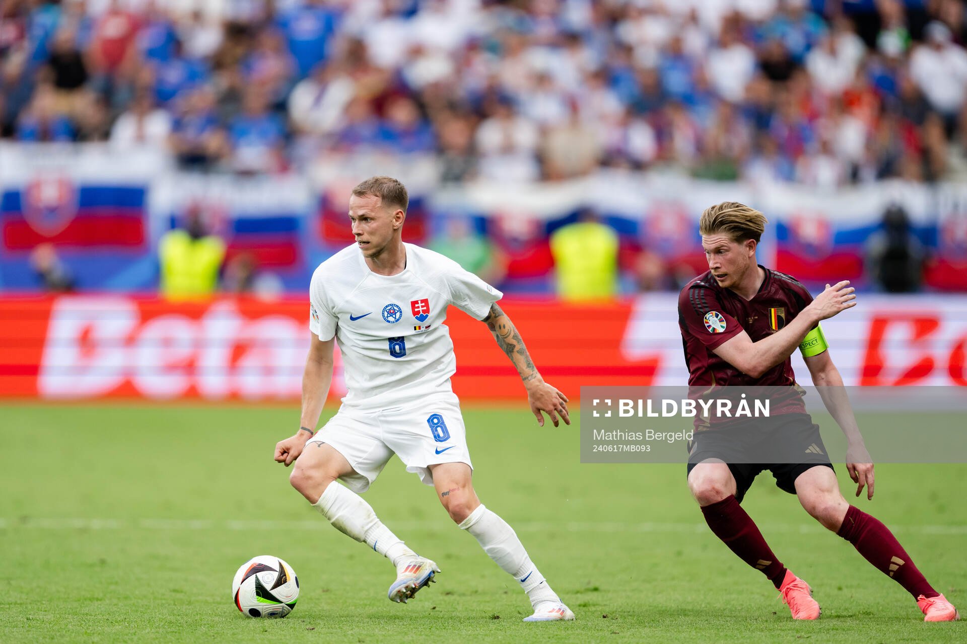 Ondrej Duda of Slovakia and Kevin De Bruyne of Belgium