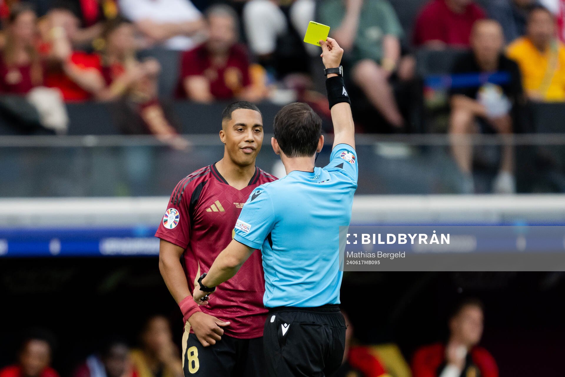 Youri Tielemans of Belgium receives a yellow card