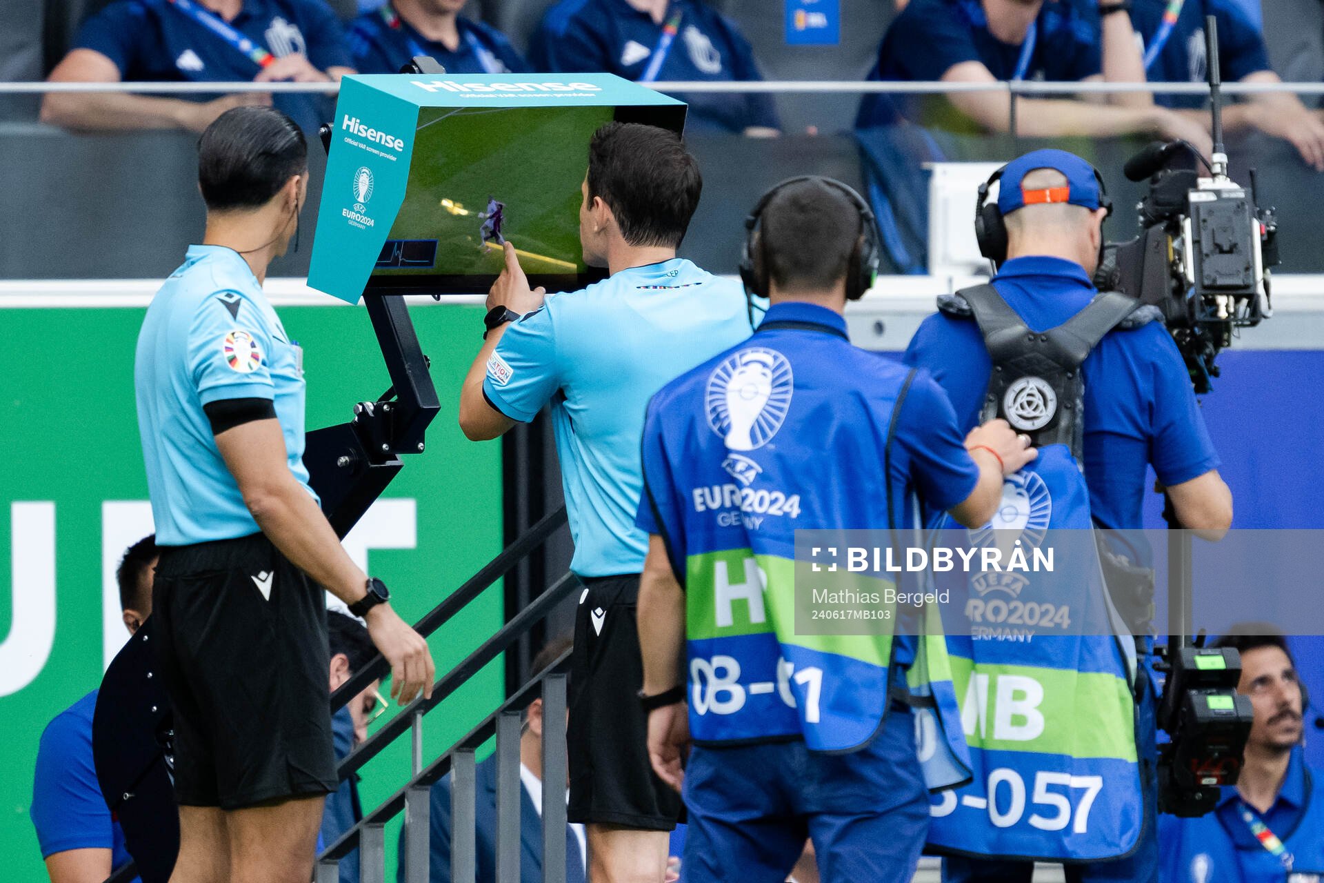 Referee Umut Meler with a VAR review