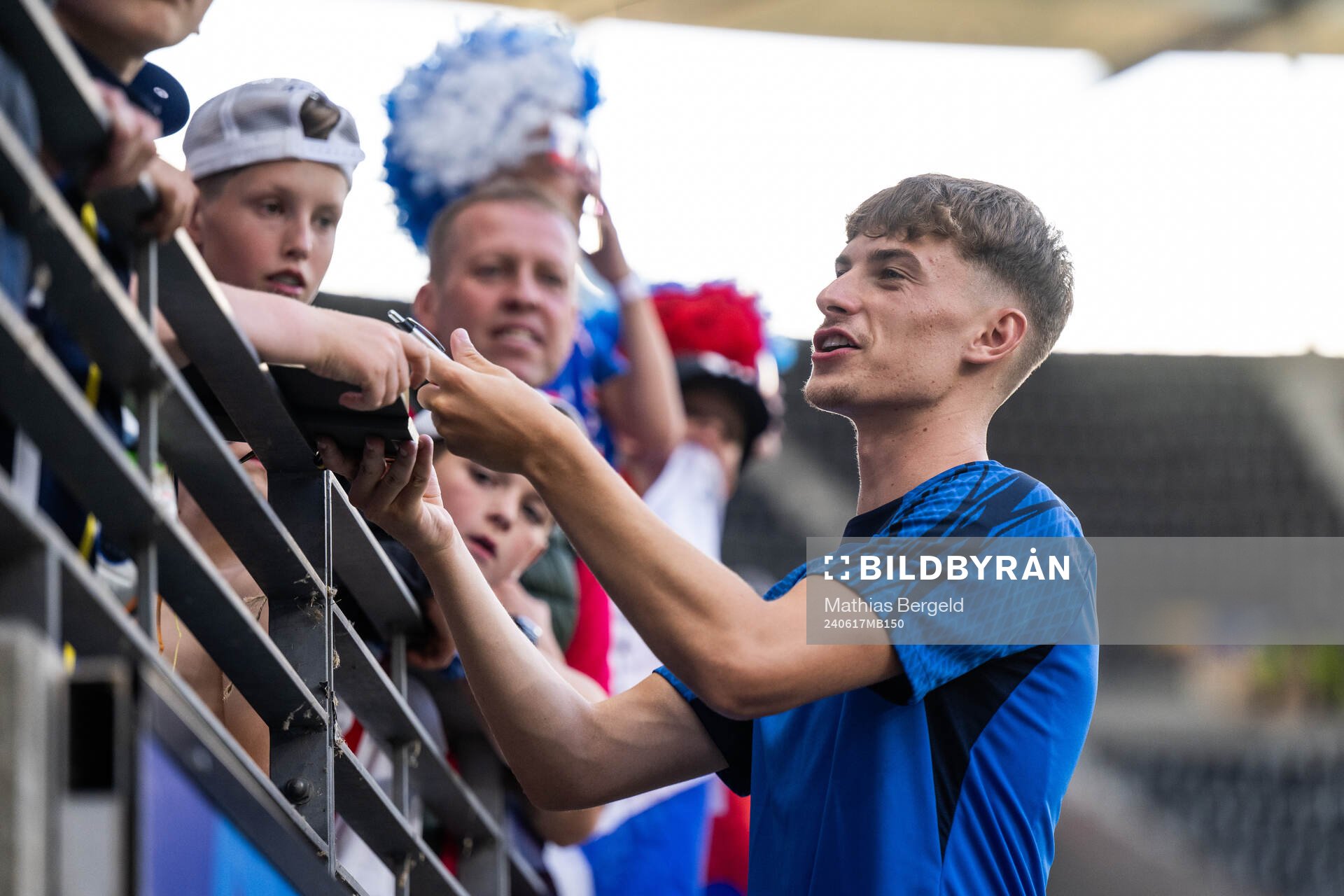 Tomas Rigo of Slovakia signs autographs