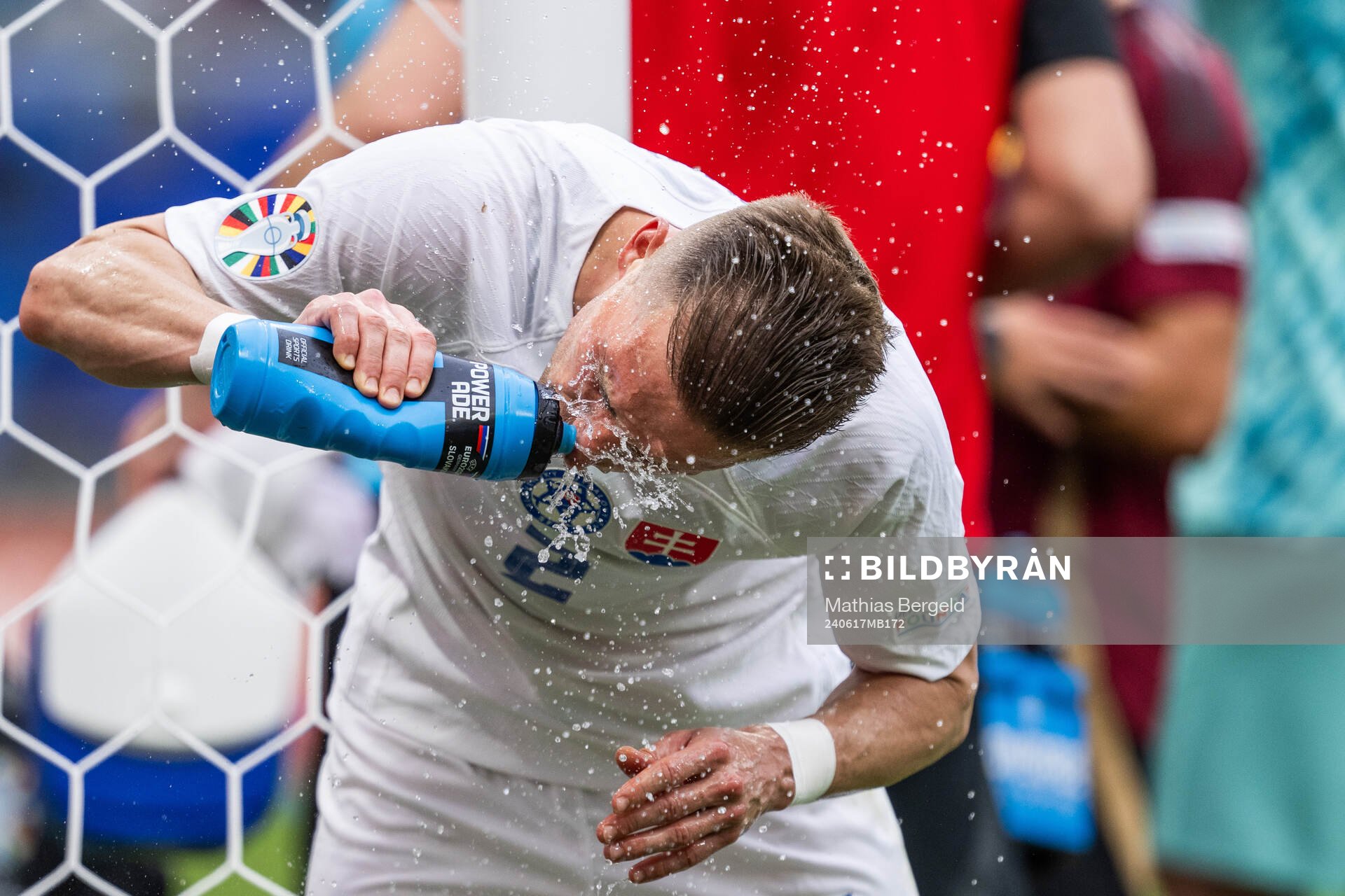Peter Pekarik of Slovakia sprays water in his face
