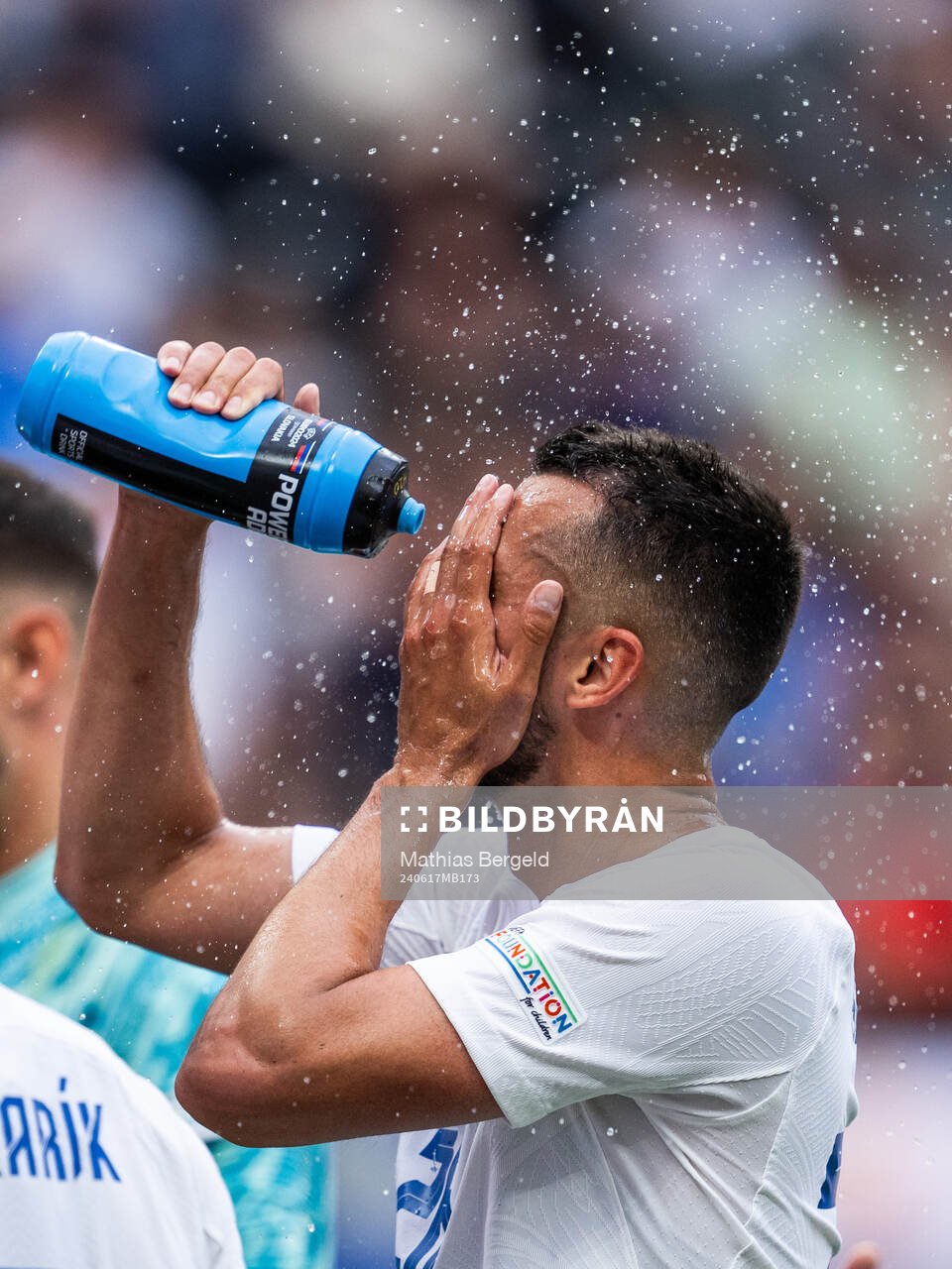 Ivan Schranz of Slovakia sprays water in his face