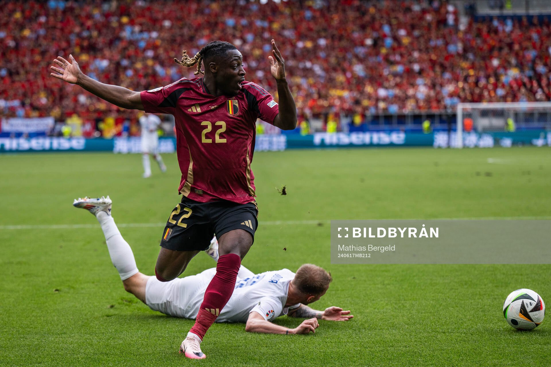 Jeremy Doku of Belgium reacts after competing for the ball with Ondrej Duda of Slovakia during the UEFA Euro 2024 Football Championship match between Belgium and Slovakia on June 17, 2024 in Frankfurt.