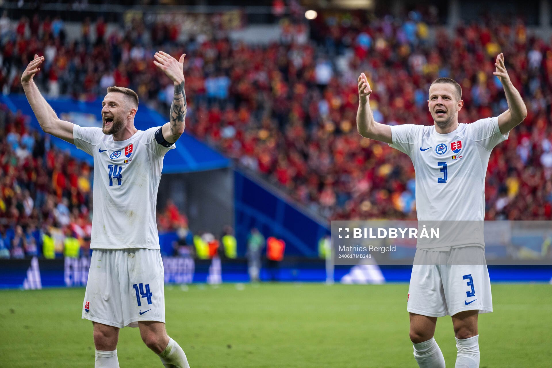 Milan Skriniar and Denis Vavro of Slovakia celebrate