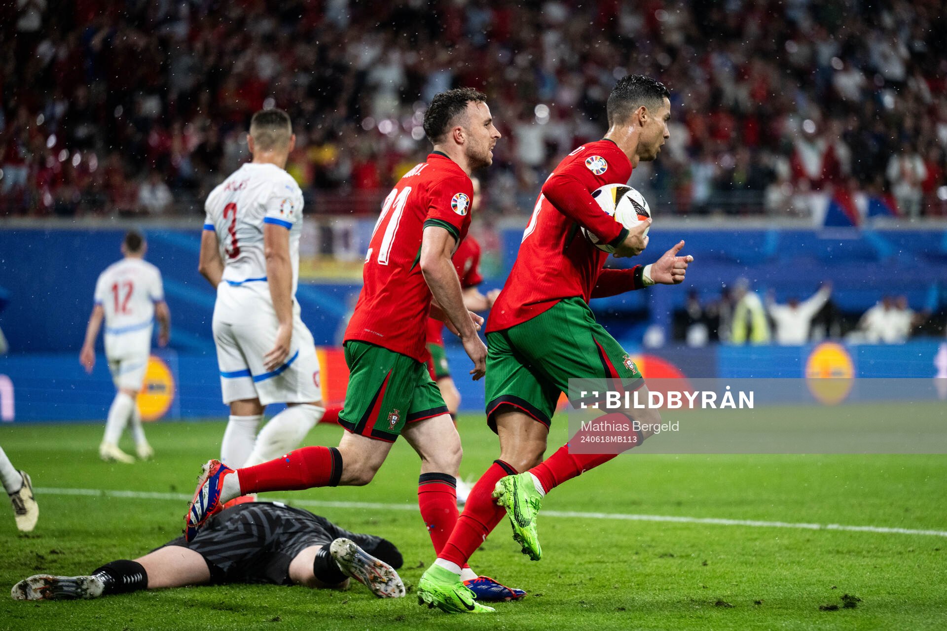Diogo Jota and Cristiano Ronaldo of Portugal celebrate after 1-1 during the UEFA Euro 2024 Football Championship match between Portugal and Czech Republic on June 18, 2024 in Leipzig.