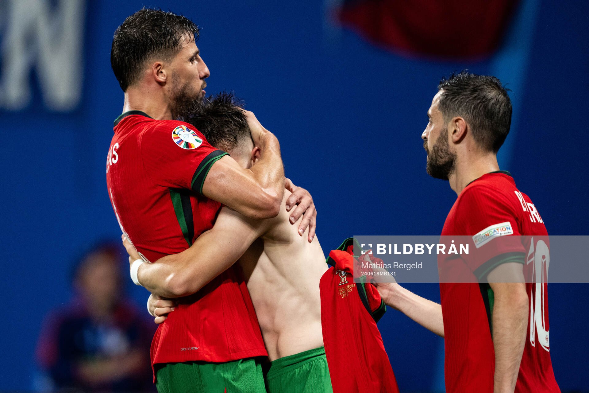 Francisco Conceicao of Portugal celebrates with Ruben Dias
