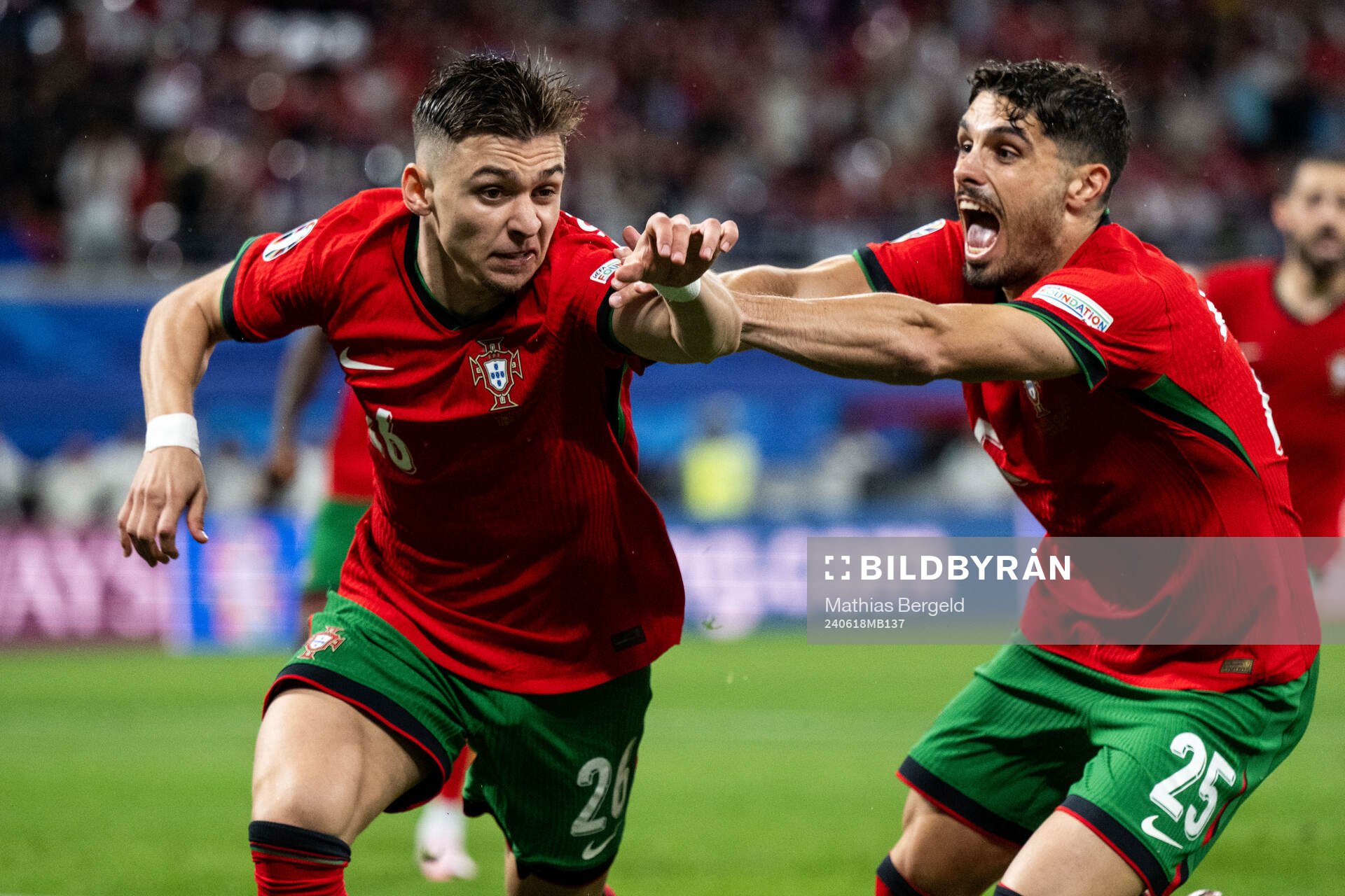 Francisco Conceicao and Pedro Neto of Portugal celebrate