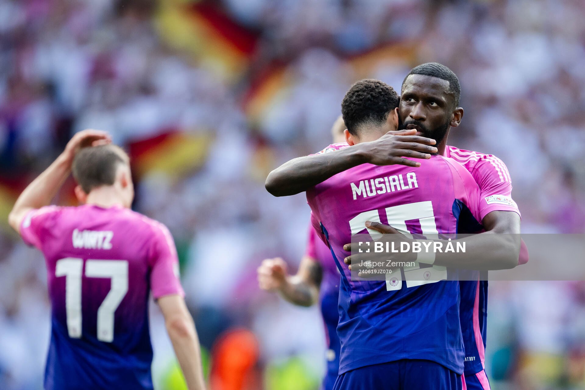 Jamal Musiala and Antonio Ruediger of Germany celebrate