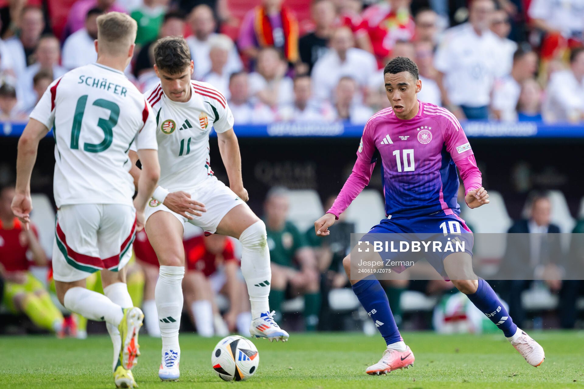 Milos Kerkez of Hungary and Jamal Musiala of Germany