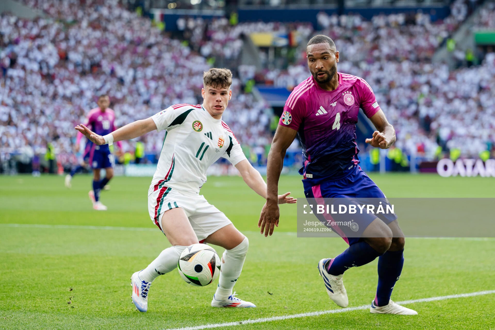 Milos Kerkez of Hungary and Jonathan Tah of Germany