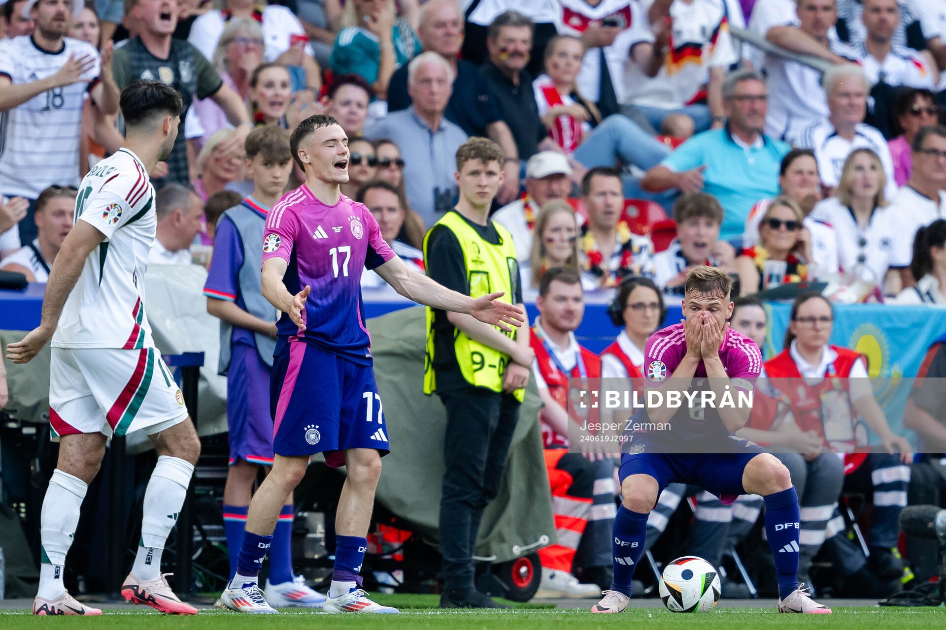 Florian Wirtz and Joshua Kimmich of Germany react
