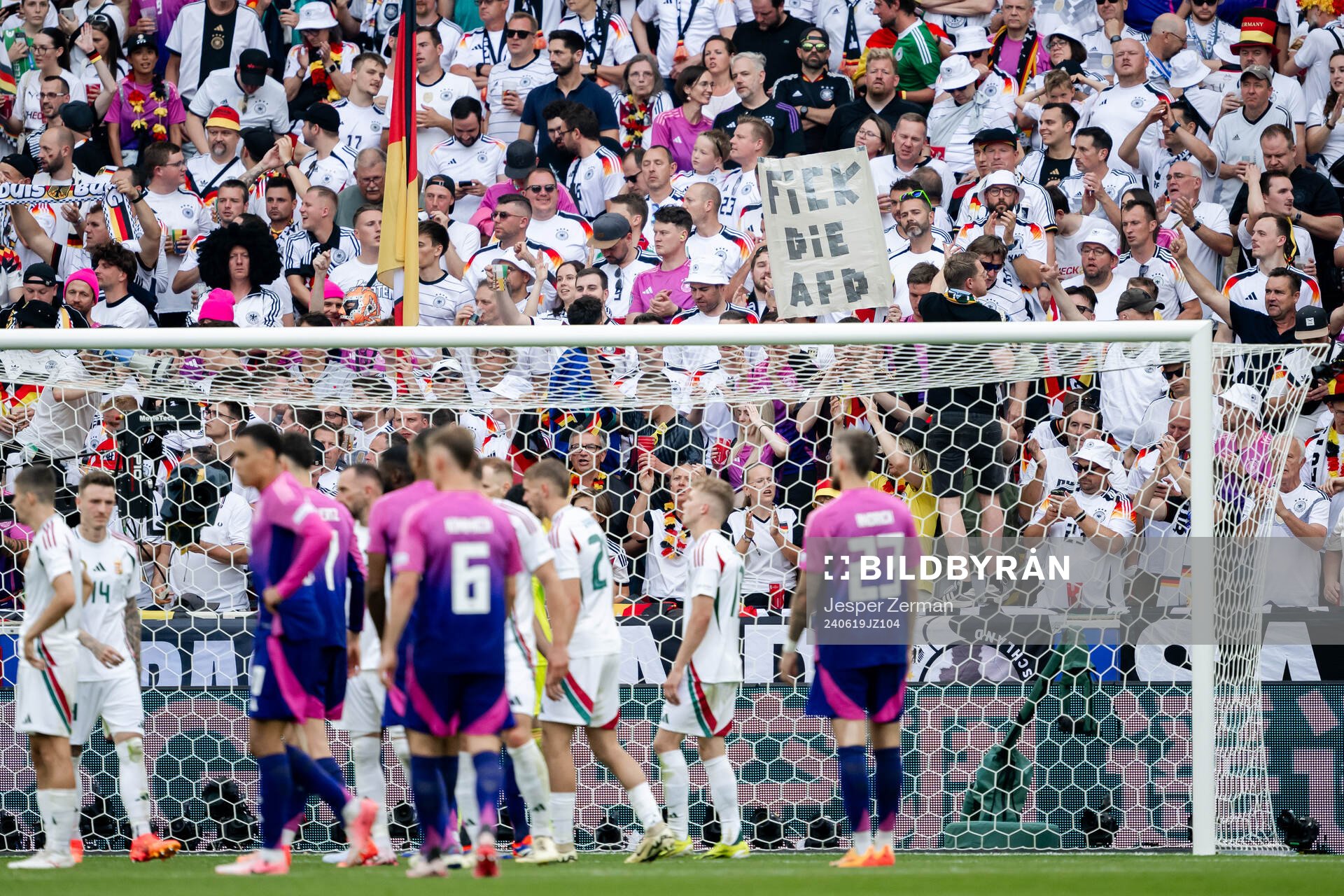 Fans with a sign