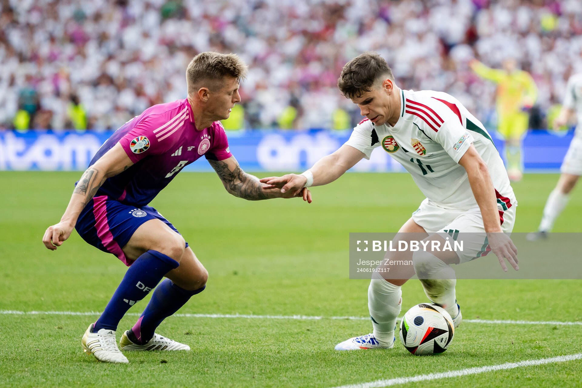Toni Kroos of Germany and Milos Kerkez of Hungary