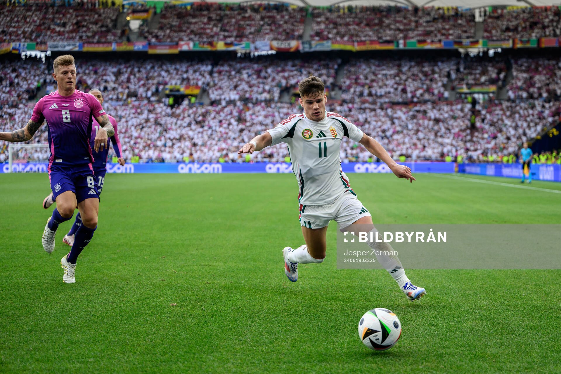 Toni Kroos of Germany and Milos Kerkez of Hungary during the UEFA Euro 2024 Football Championship match between Germany and Hungary on June 19, 2024 in Stuttgart. 
