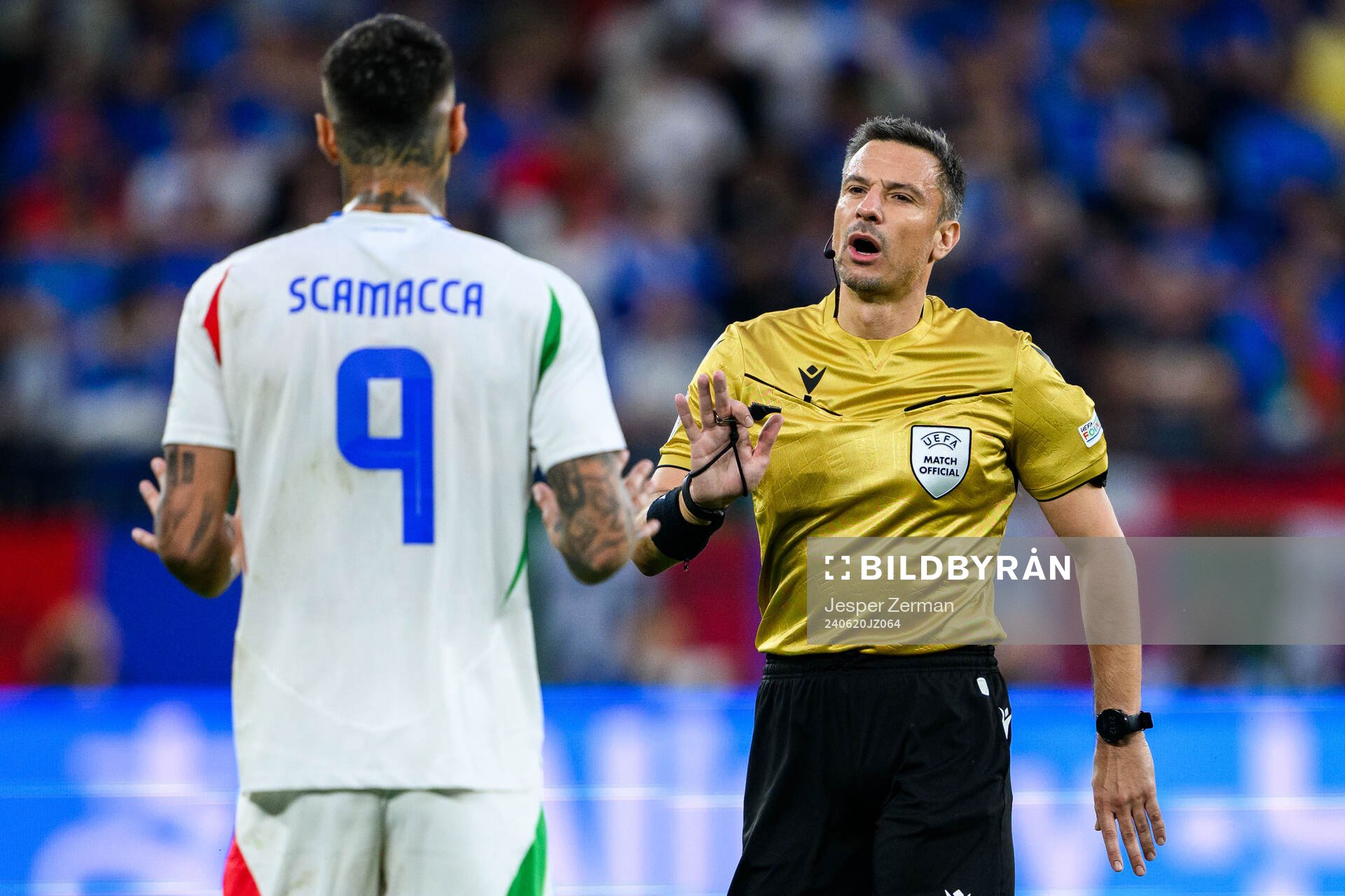 Gianluca Scamacca of Italy and referee Slavko Vincic during the UEFA Euro 2024 Football Championship match between Spain and Italy on June 20, 2024 in Gelsenkirchen.