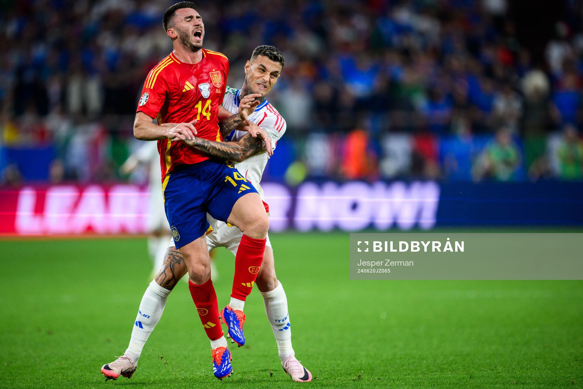Aymeric Laporte of Spain and Gianluca Scamacca of Italy