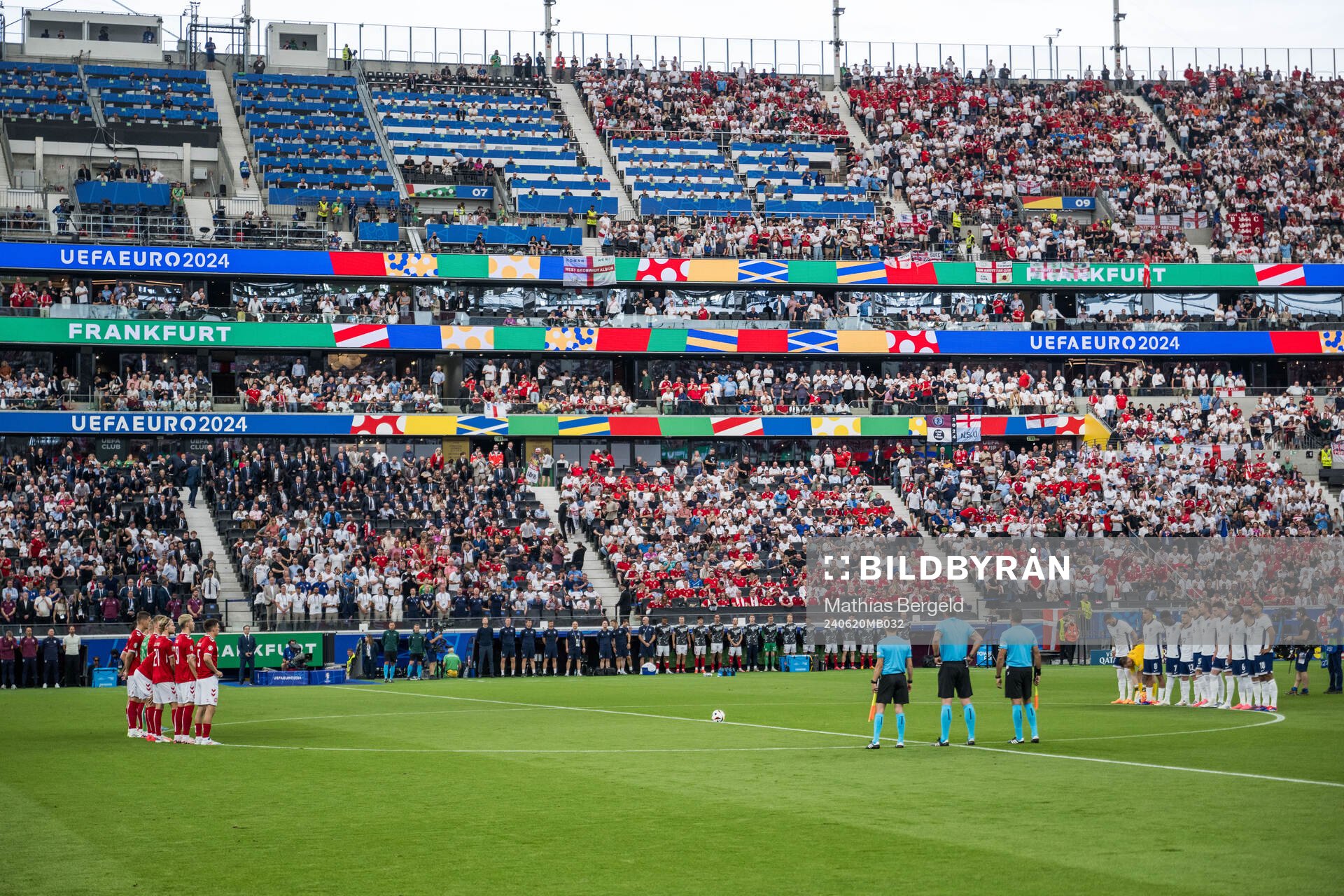 Players of Denmark and of England honouring the memory of