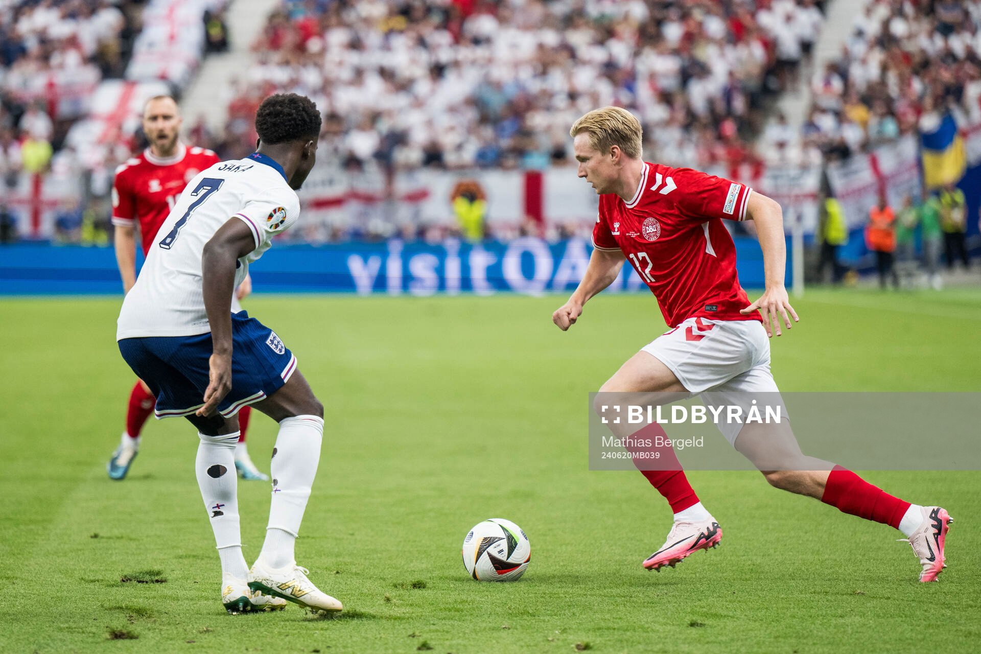 Bukayo Saka of England and Victor Kristiansen of Denmark