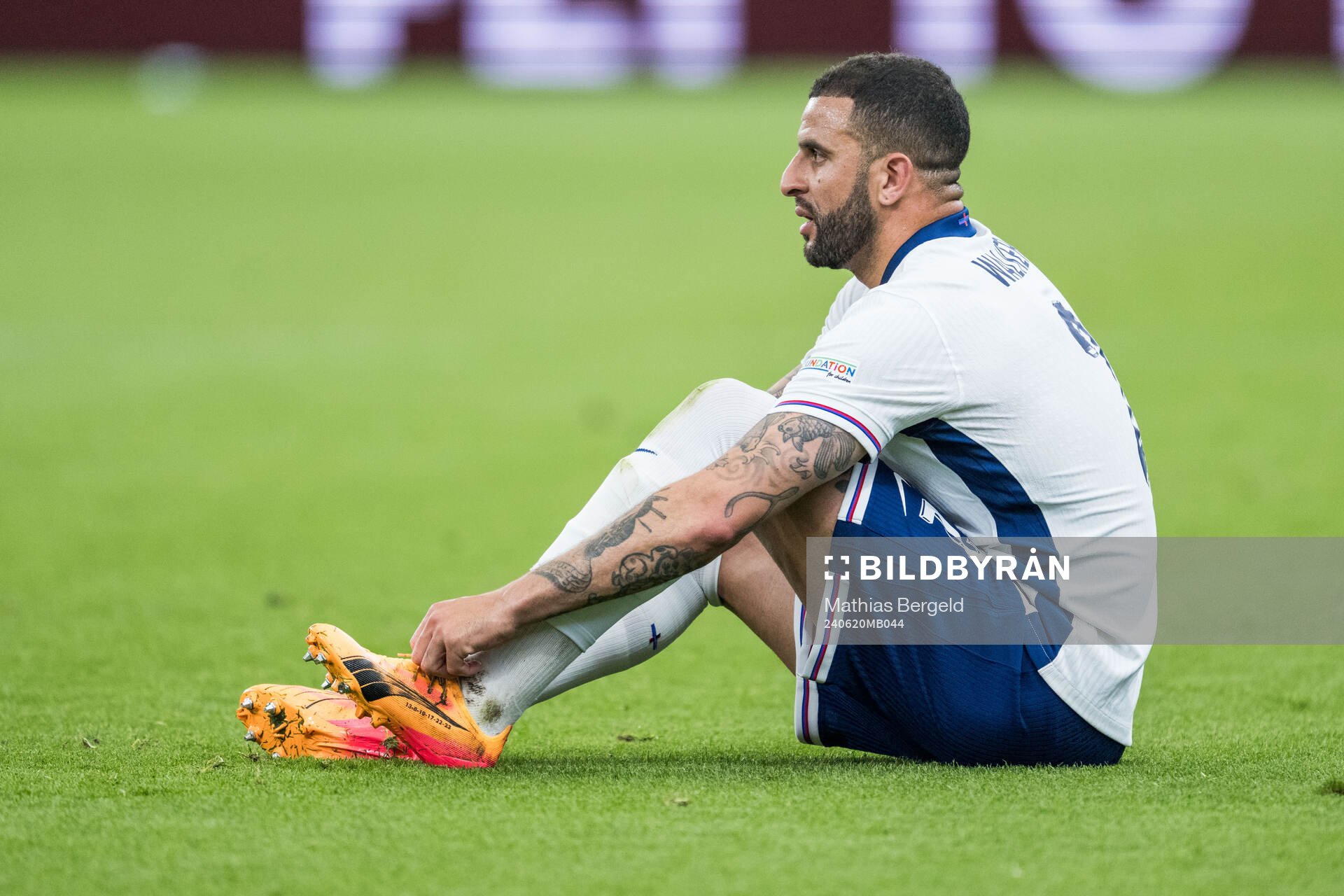 Kyle Walker of England changes shoes