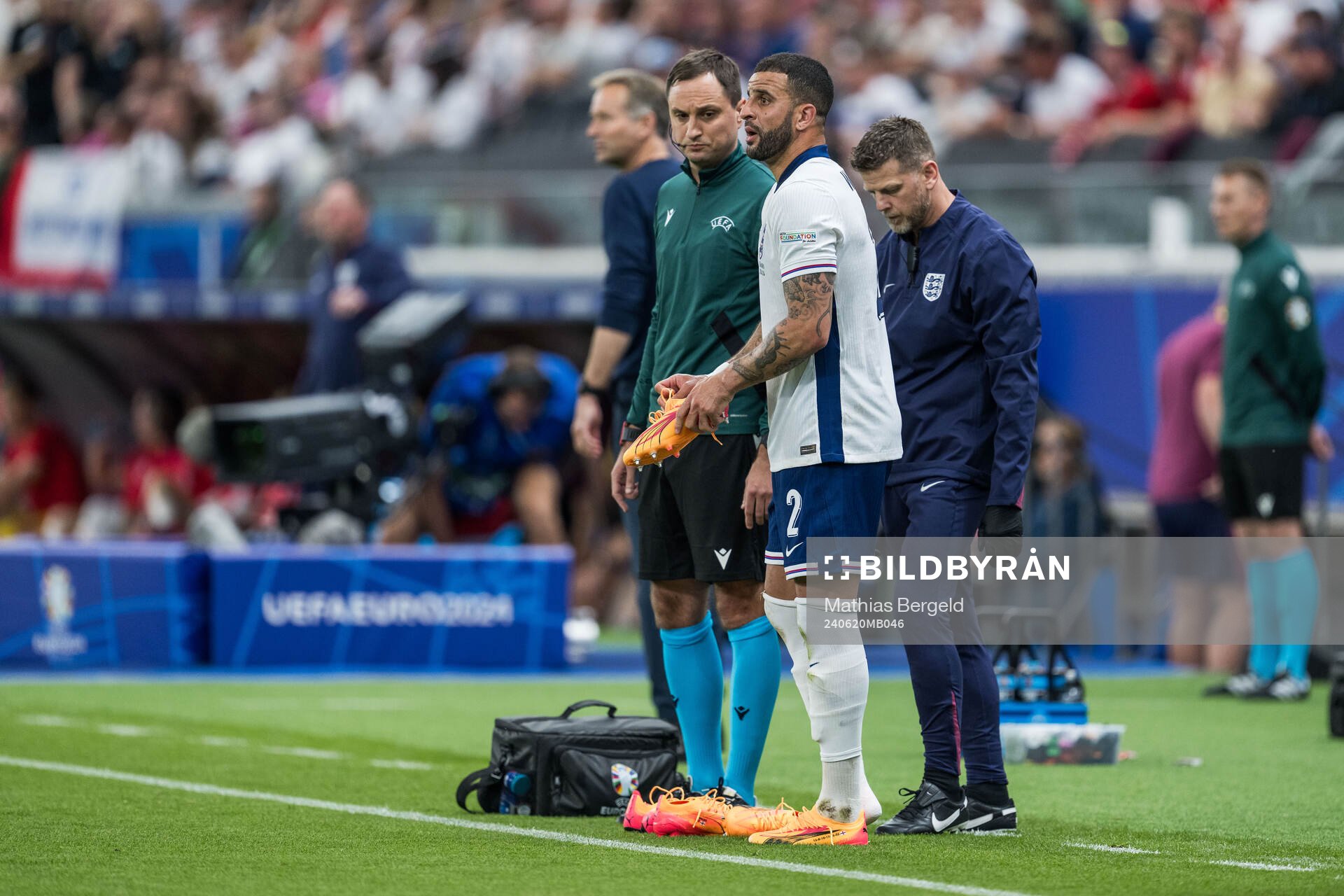 Kyle Walker of England changes shoes