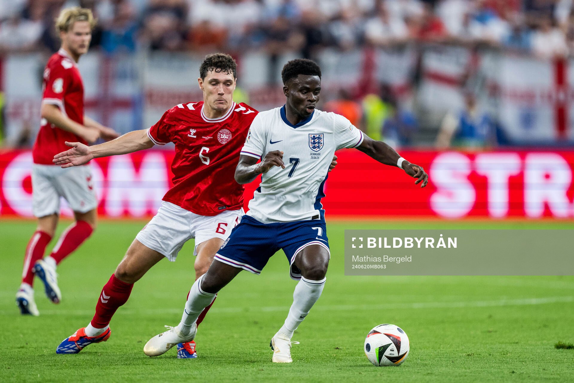 Andreas Kristiansen of Denmark and Bukayo Saka of England