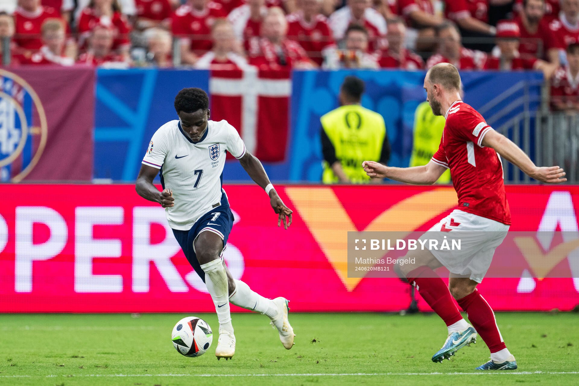 Bukayo Saka of England and Christian Eriksen of Denmark