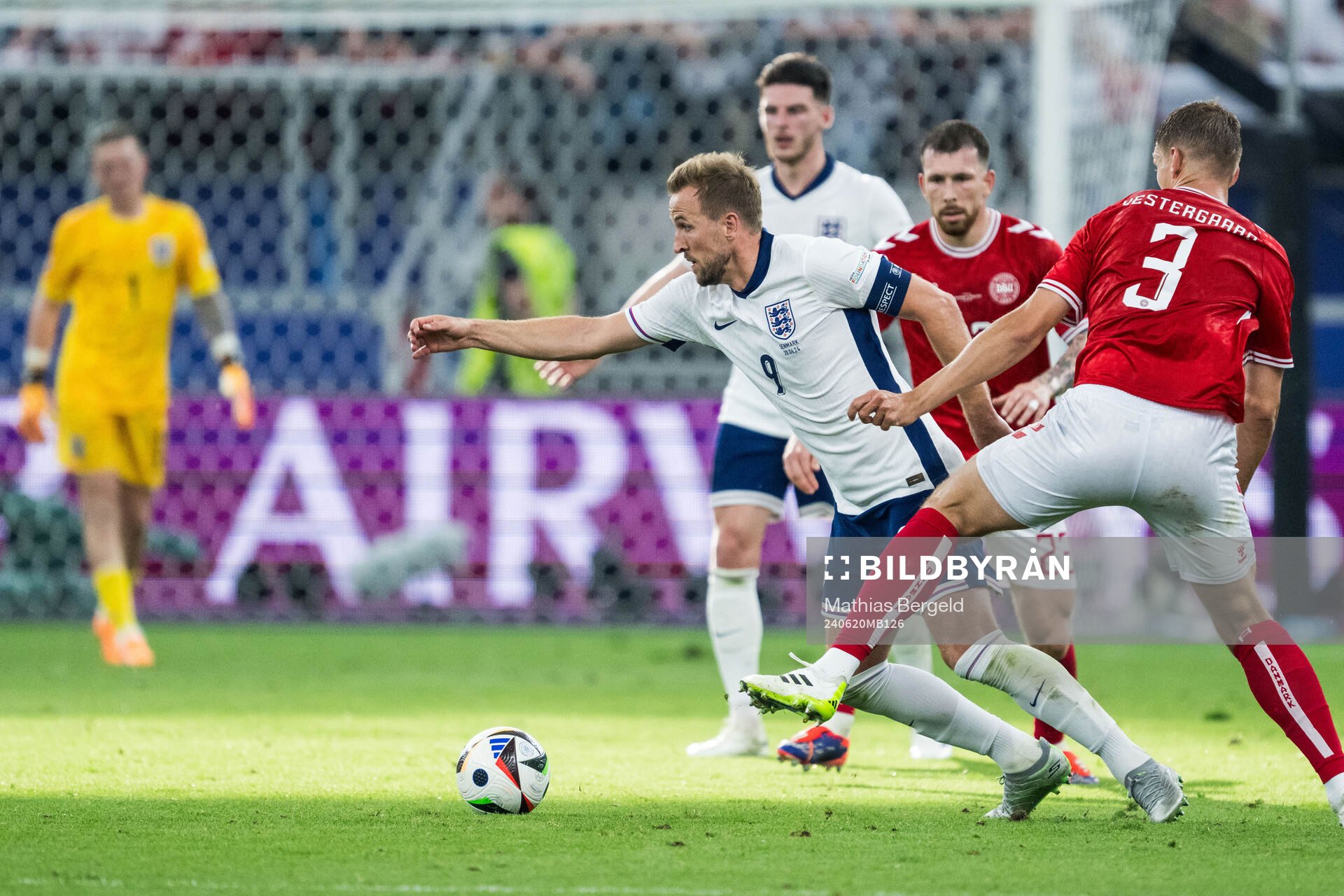 Harry Kane of England and Jannik Vestergaard of Denmark