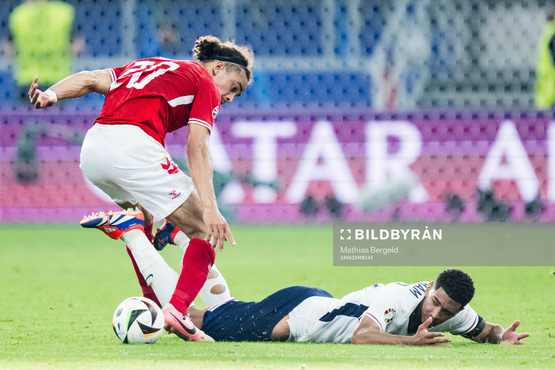 Yussuf Poulsen of Denmark and Jude Bellingham of England