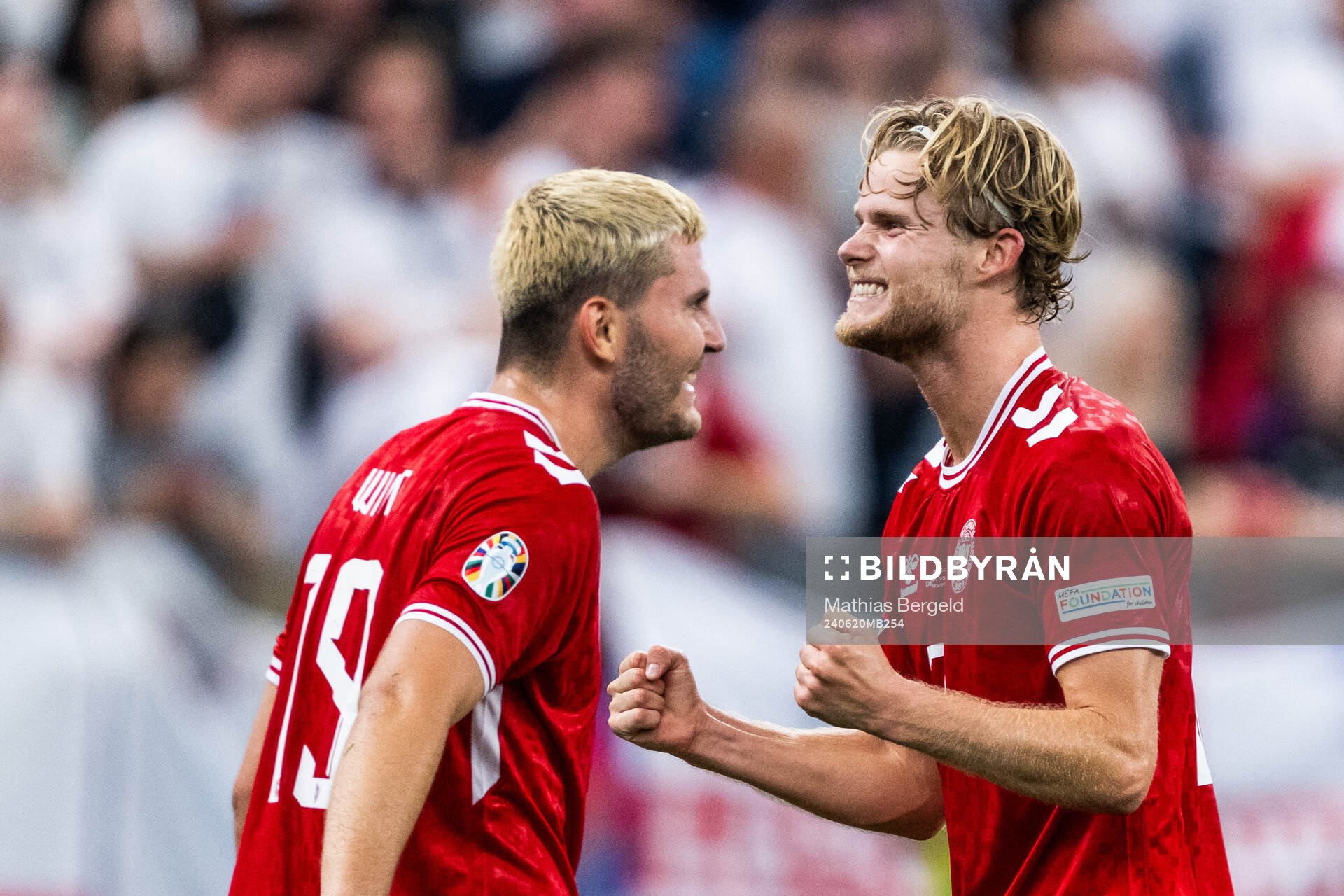 Jonas Wind next to Morten Hjulmand of Denmark who
