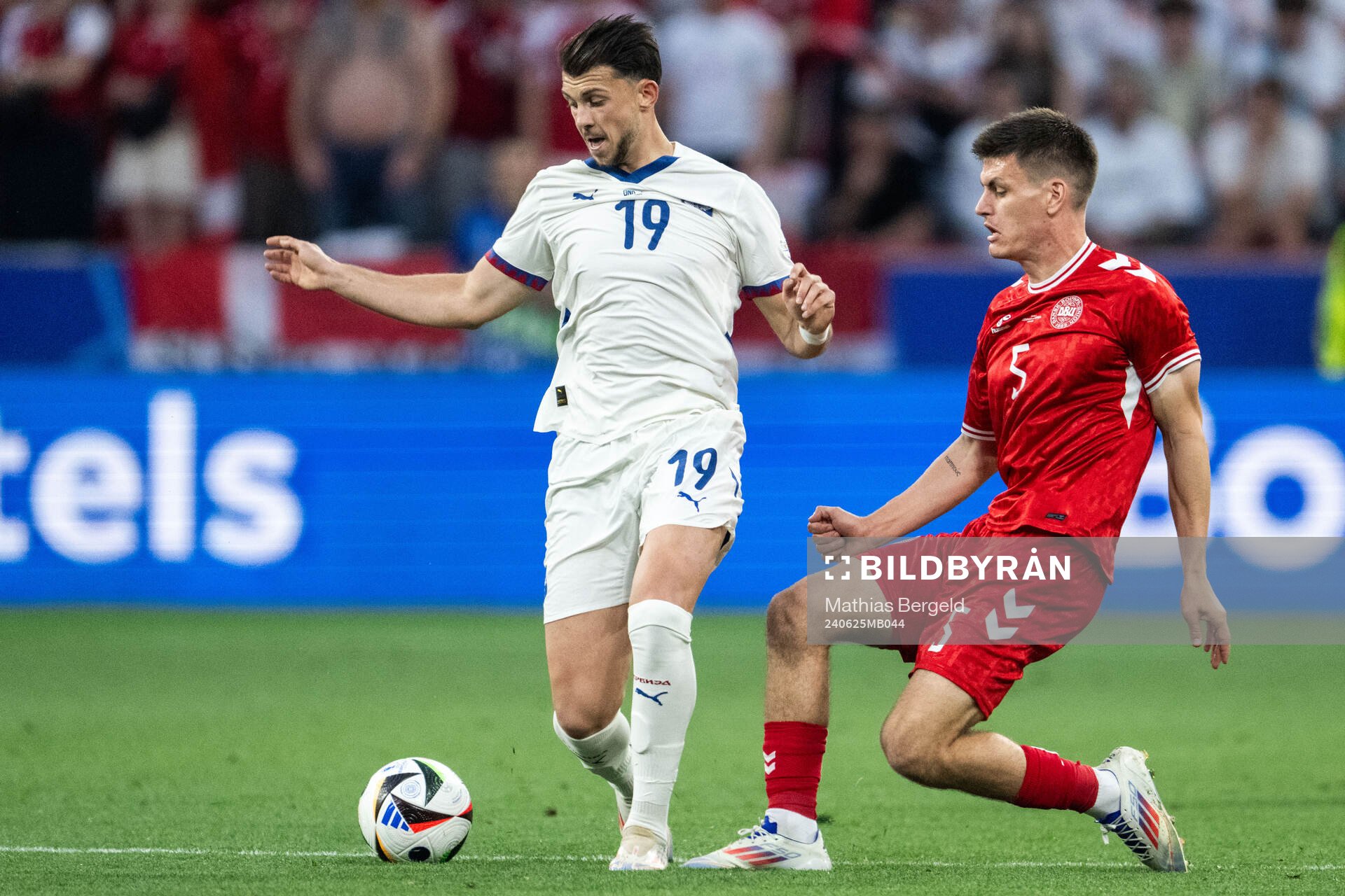 Lazar Vujadin Samardzic of Serbia and Joakim Mæhle of