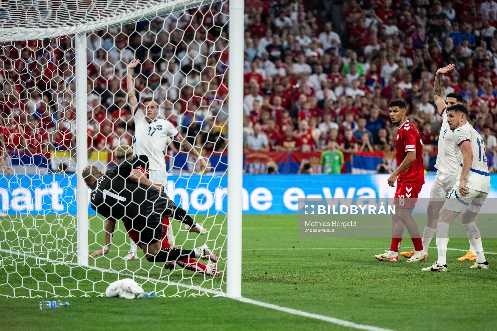 Goalkeeper Predrag Rajkovic of Serbia and Jonas Wind of