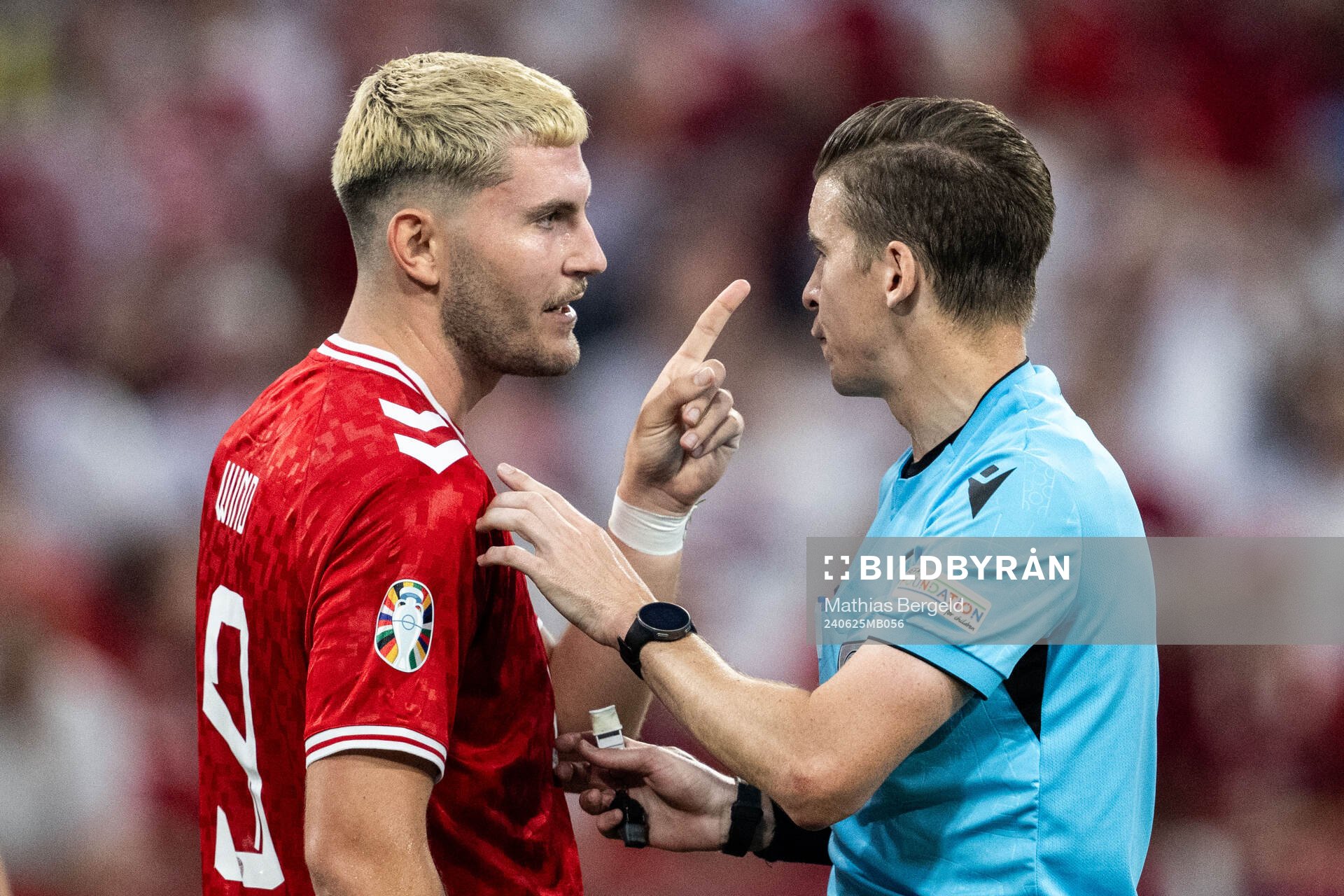 Jonas Wind of Denmark reacts against referee François