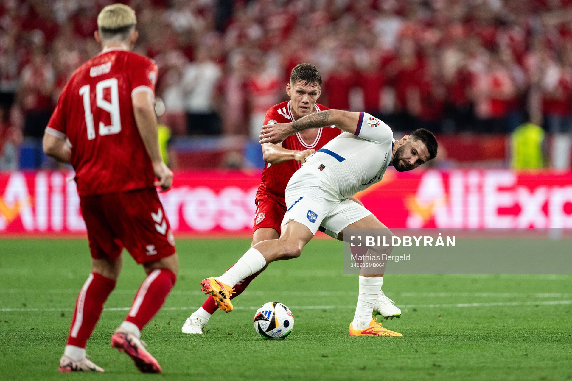 Jannik Vestergaard of Denmark and Aleksandar Mitrovic of