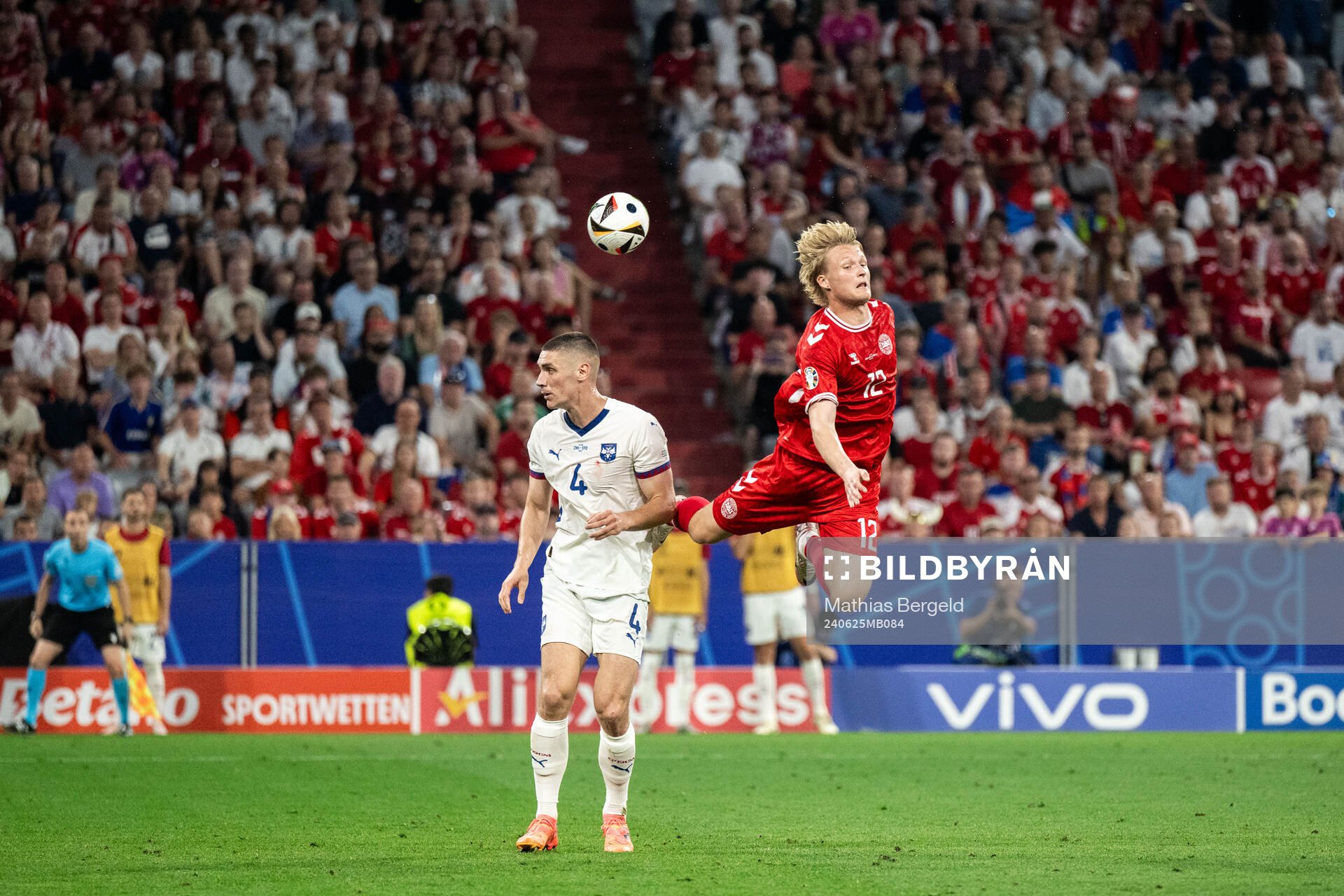 Nikola Milenkovic of Serbia and Kasper Dolberg of Denmark