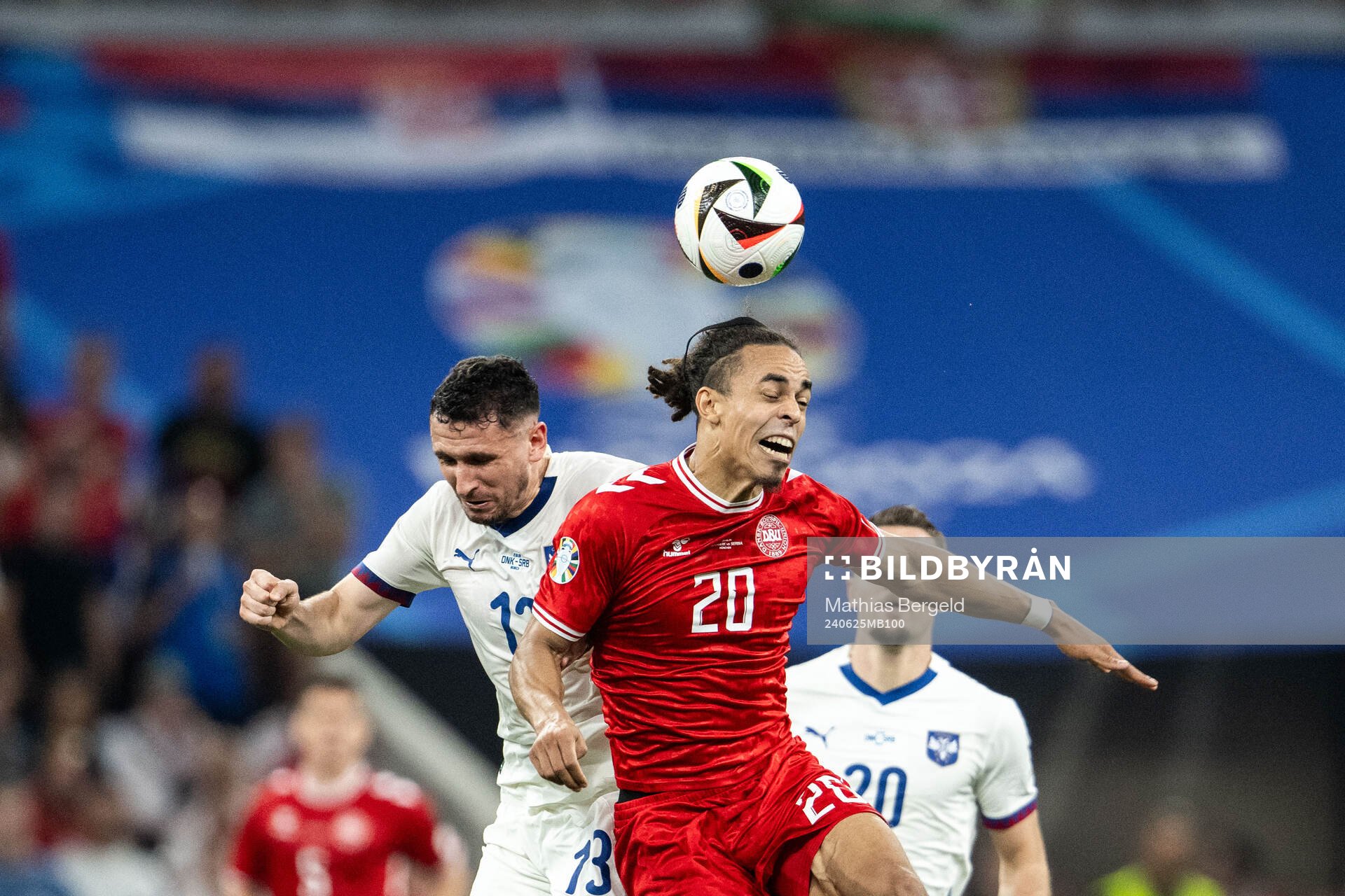 Milos Veljkovic of Serbia and Yussuf Poulsen of Denmark