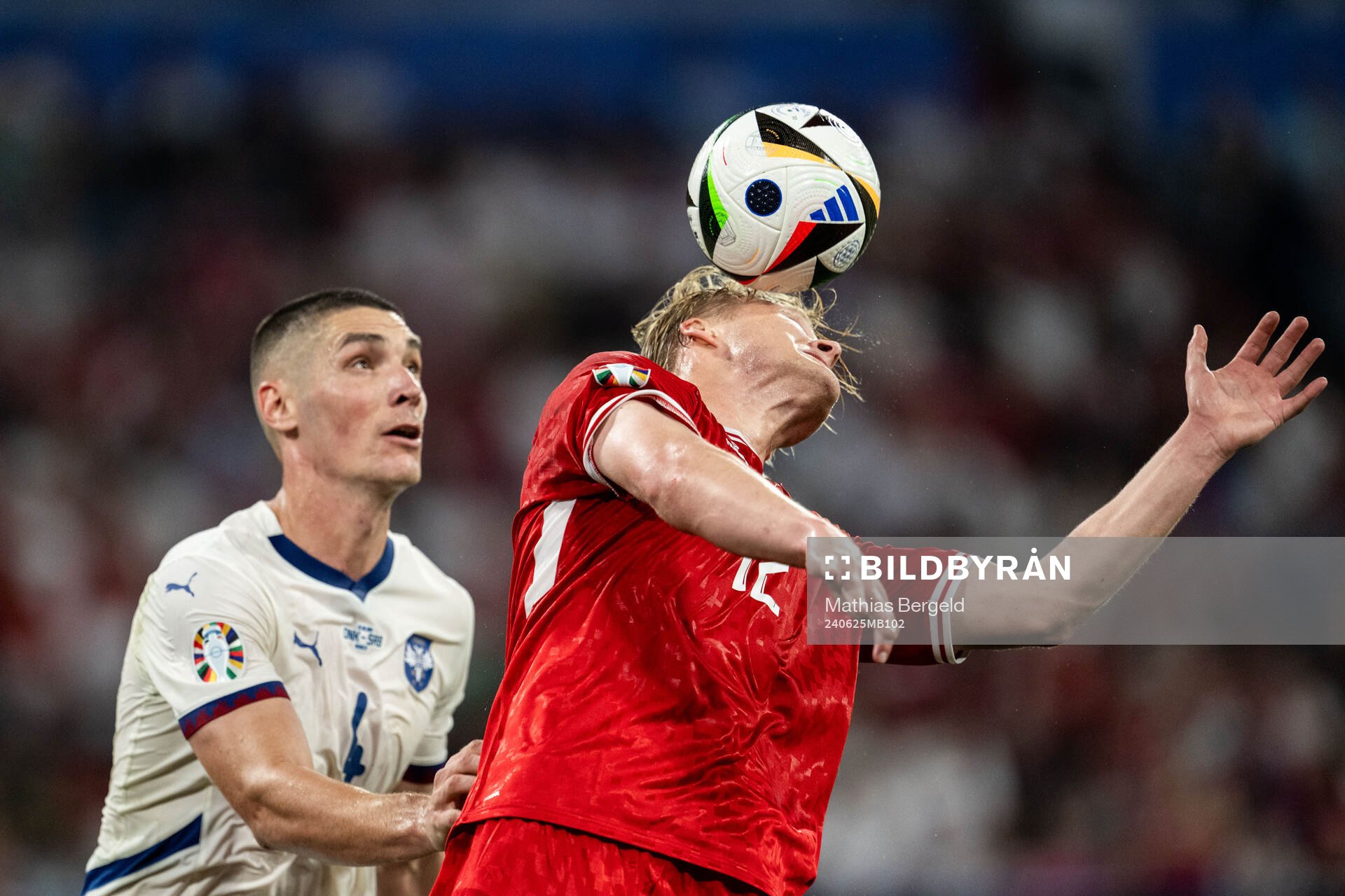 Nikola Milenkovic of Serbia and Kasper Dolberg of Denmark