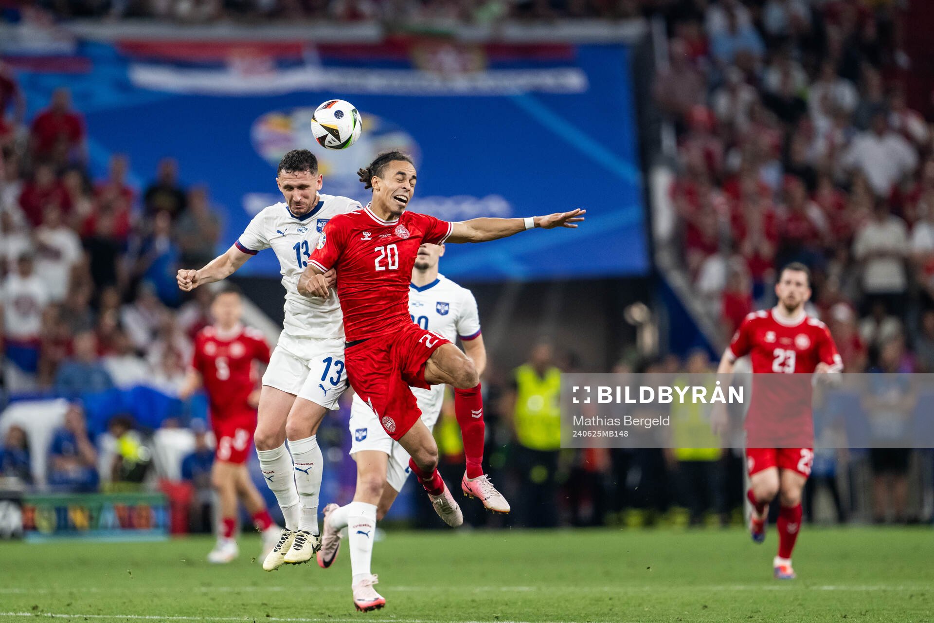 Milos Veljkovic of Serbia and Yussuf Poulsen of Denmark