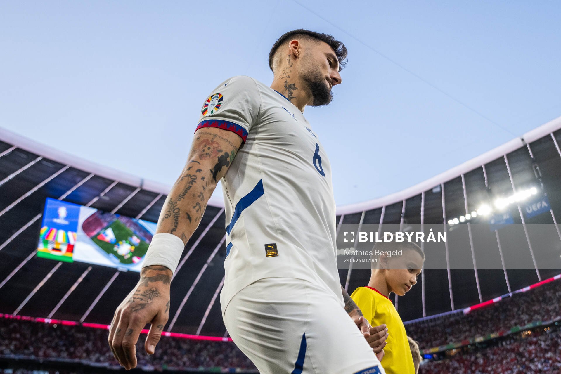 Nemanja Gudelj of Serbia enters the pitch